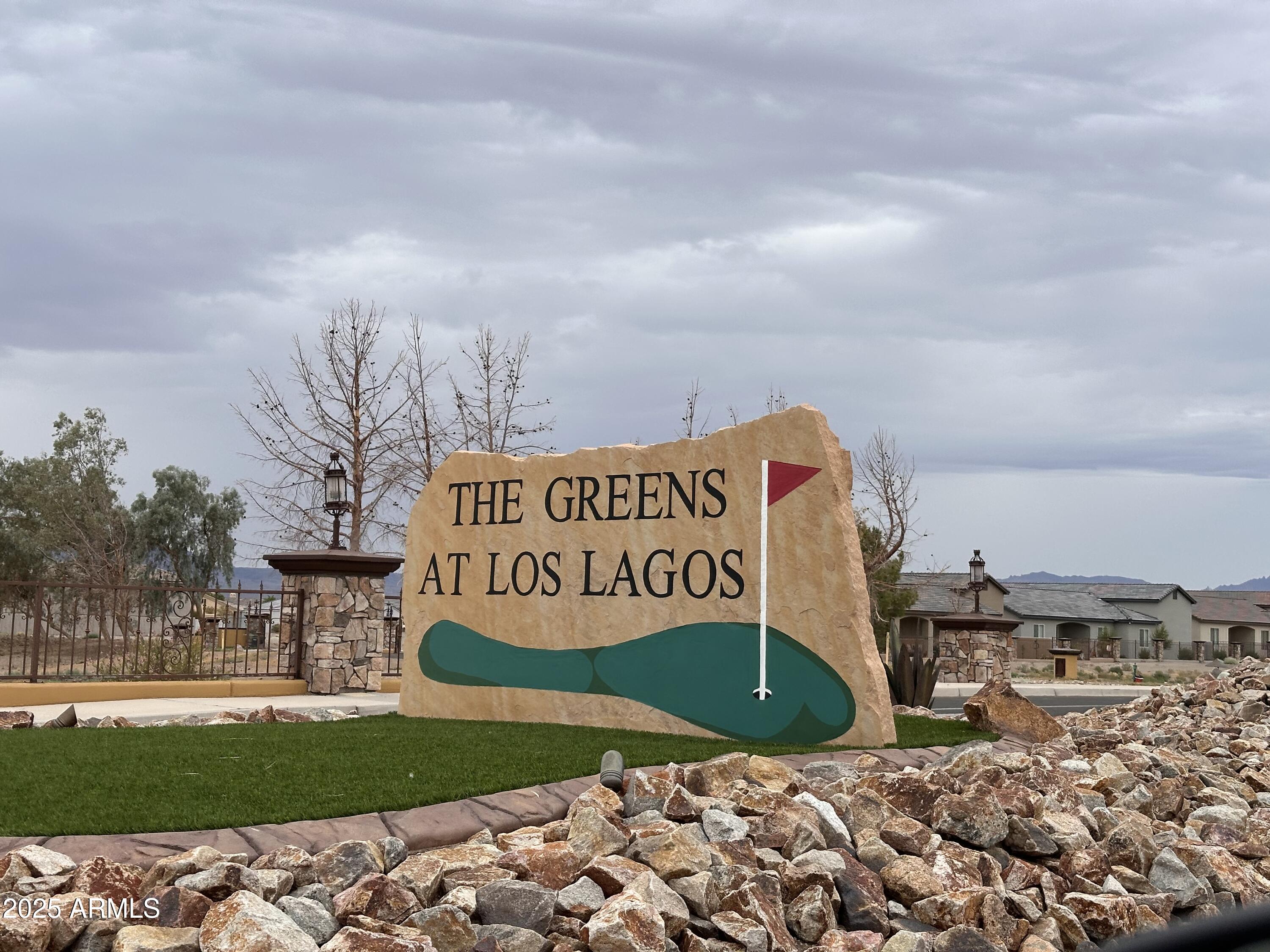 Your dream home is awaiting for you on this paradise golf course subdivision at The Greens at Los Lagos. Build your dream house on this 1/4 acre lot. Enjoy the panoramic views of the mountains and golf course. Niegborhood features walking pathways and bike trails while enjoying sunrise or sunset.  Minutes away by Colorado River and multiple golf course. You'll enjoy the world class amenities of the Los Lagos Golf club. 30 minutes away from Laughlin NV Casino, Hotels and entertainments.  You're 1.5 hours only to Las Vegas NV Strip.