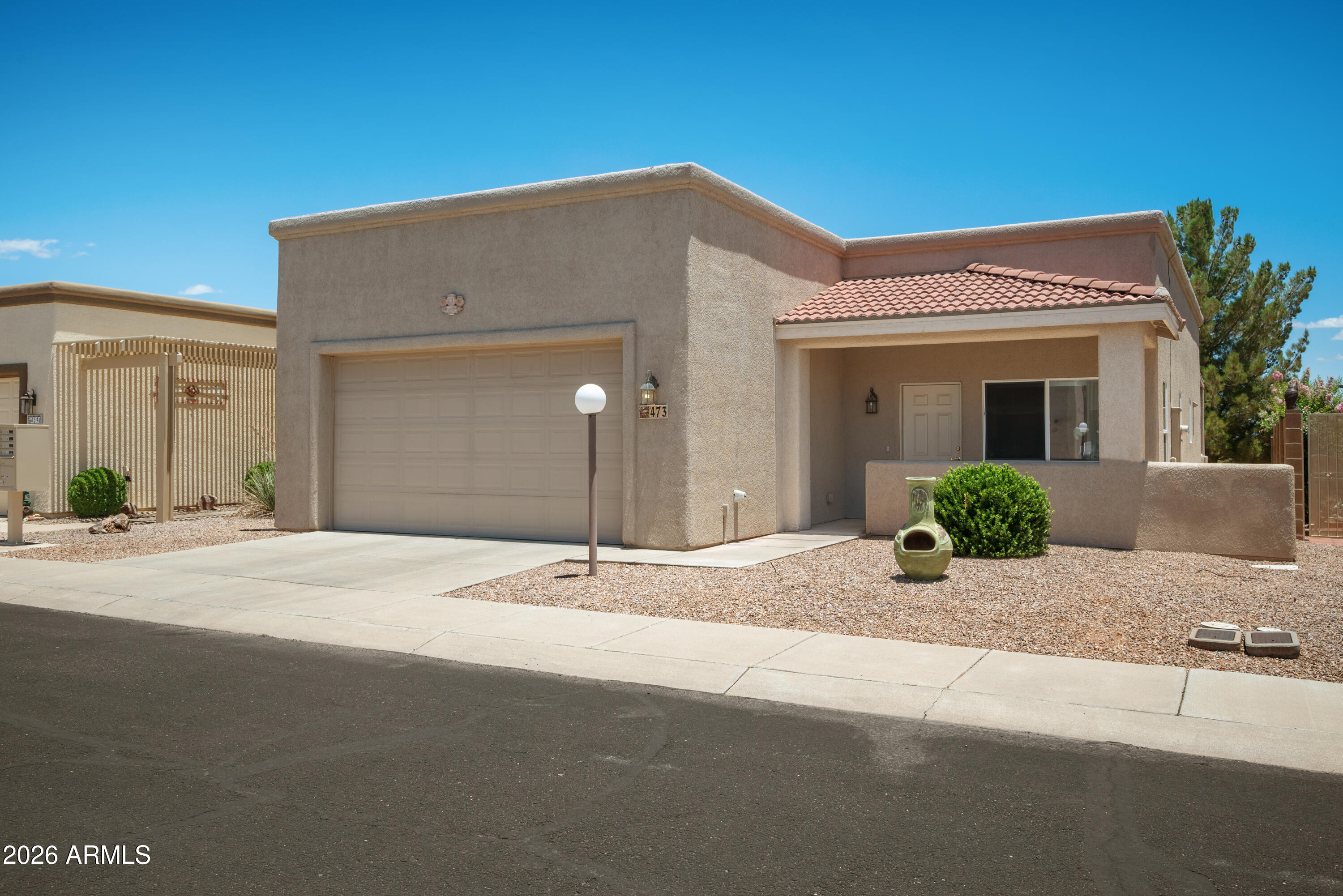 Welcome to Vista View Resort! This well-maintained 2-bedroom, 2-bath home offers 1,588 sq. ft. of comfortable living with thoughtful accessibility features, including widened entry doorways, lowered cabinet heights, grab bars, and a low-step walk-in shower. The home features tile flooring throughout and recent updates including a newly coated roof, new refrigerator, and washer and dryer. A huge TV also conveys with the home. Relax on either of the two covered patios or enjoy the resort-style amenities, including a clubhouse, swimming pool, pickleball courts, and a full calendar of activities in this vibrant community.