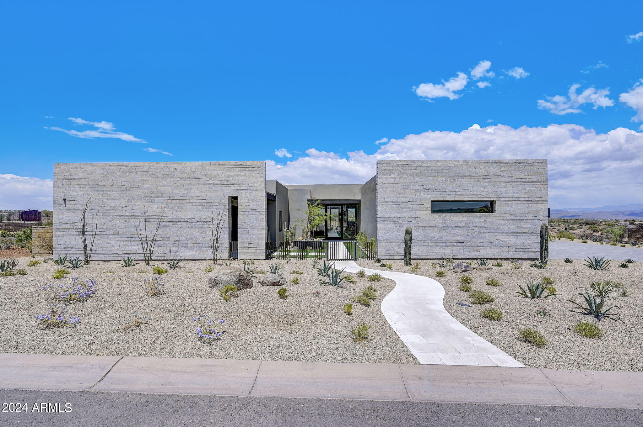 **AGENTS - Please read private remarks** 
This incredible new construction home features a Full Landscape Package with Pool, Gourmet Outdoor Kitchen, A Spacious Back Prep Kitchen, Mirlux Cabinets, Wolf Appliances, Modern Tile Flooring, Quartzite Countertops, Contemporary Glass Pivot Entry Door, Infrared Ceiling Patio Heaters. With trails offering access to the Preserve and its 150+ mile trail network, life at Storyrock includes convenient access to Tom's Thumb and endless opportunities to enjoy nature. Storyrock offers a rare opportunity to live within close proximity to the best of Scottsdale while also among Arizona's timeless natural treasures, all within a distinctly modern setting. Property completion date is roughly 30-60 days from accepted purchase contract.