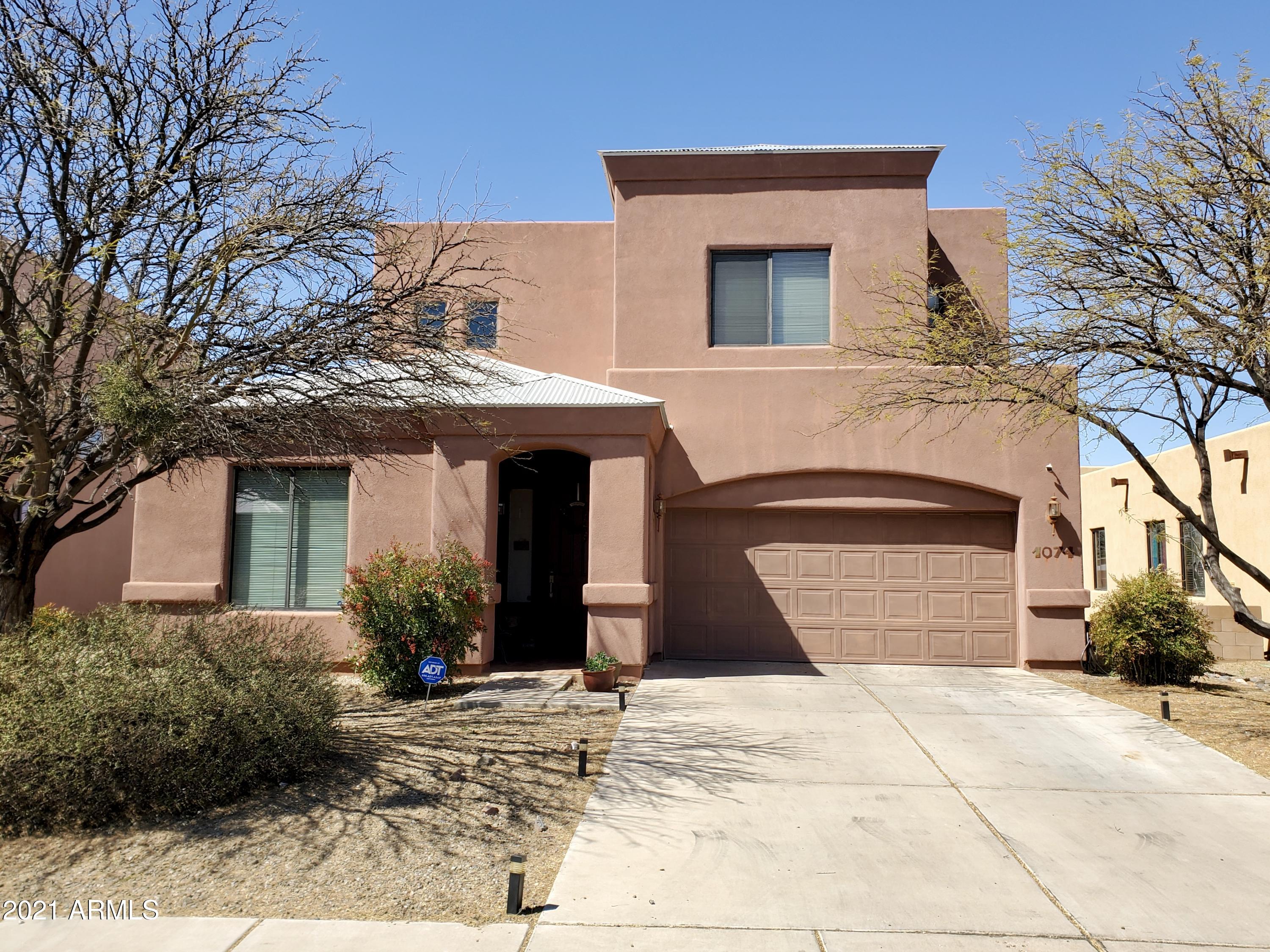 Outstanding property!!!  Do you need extra space??? It's here!  5 bedroom, 3 bathroom property with two living areas on a lot overlooking a wash.  No neighbors behind you!  Primary bedroom has a large balcony, view panels in fencing, all tile on first floor, desirable neighborhood that is near it all! (Refrigerator does not convey)
