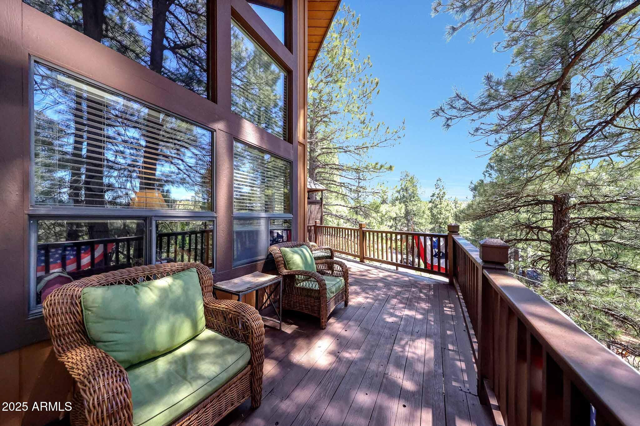 Owner has bought a new home in Sedona and wants this home sold! Property is an active vacation rental that generates annual income. Being sold with all furniture! Electronics & washer/dryer do not convey. Come enjoy this Mountain Chalet with panoramic views of the forest, Lake O'dell, and the surrounding mountains. Soaring T&G ceilings, large windows bringing into natural light, a stone fireplace, an open kitchen with stainless appliances and granite countertops. Both levels have large decks that have recently been painted. Widened concrete driveway, fenced yard with a treehouse and fire pit area, and a lift for transporting items. Walking distance to the lake and trails.