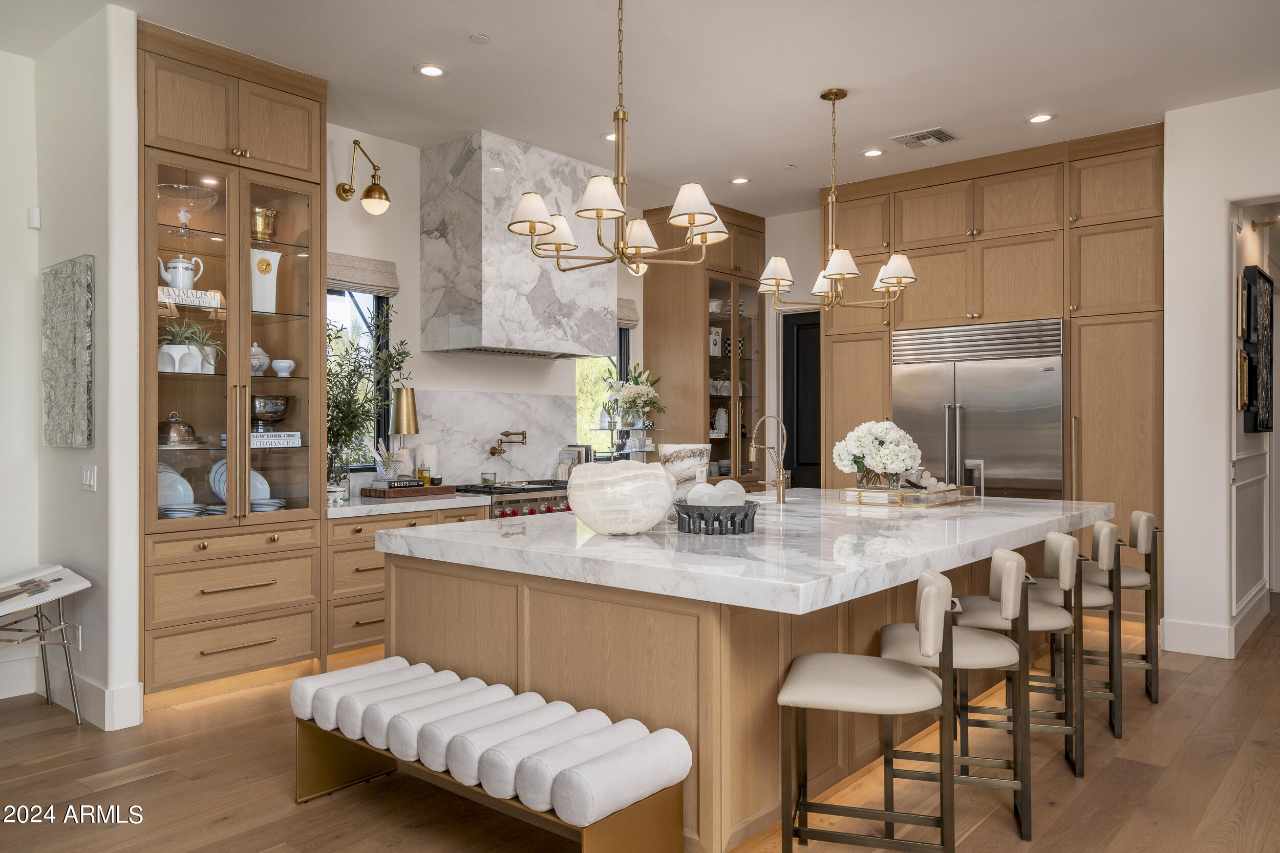 Luxury in every detail. Sitting on over an acre in Scottsdale's Pinnacle Peak Place. 4 ensuite bedrooms, a chef's kitchen, 2 living rooms, formal dining, and an oversized den.No details were overlooked when it comes to this extensive renovation.Custom features include white oak cabinetry, marble counters, luxury lighting, a plaster fireplace, and three 12-foot exterior sliders.  Freshly remodeled backyard features a brand new pool and spa, outdoor kitchen with a pizza oven, and a 14' fireplace making it an entertainer's dream.A spacious detached casita with its own kitchen, living room, bedroom and bath adds over 800 sqft included in 5,647.Surrounded by breathtaking mountain views and located near golf courses, shopping, schools, and the 101 freeway. Available Turnkey*some exclusions.