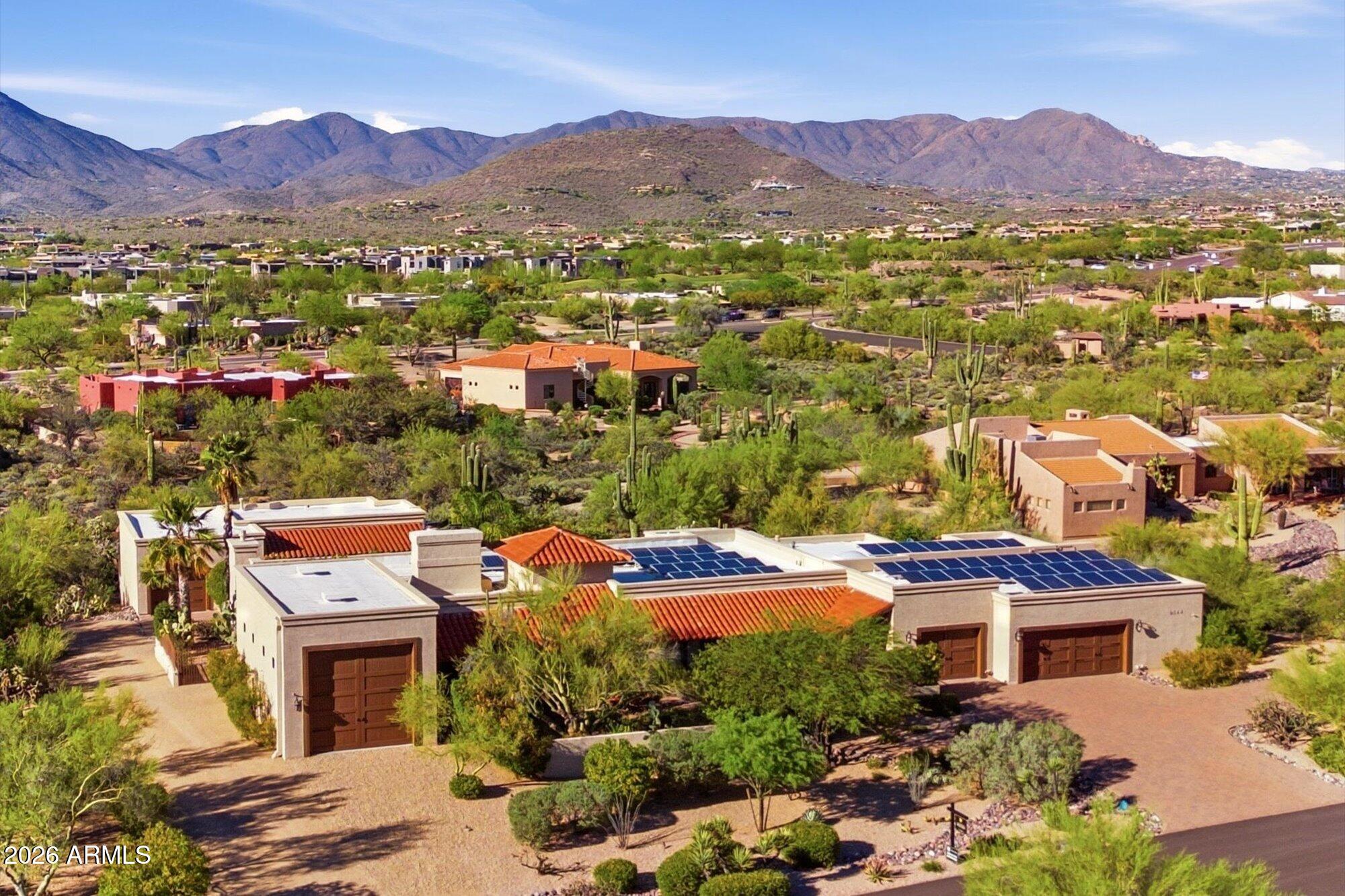 Wow! This extraordinary estate truly has it all. Situated on over an acre in a private, quiet setting with stunning mountain views, this exceptional property offers space, versatility, and resort-style living. Highlights include a 37-ft RV garage, a detached 1,150 sq ft guest house with its own driveway and garage, a 3,443 sq ft main residence with a 1,085 sq ft garage and additional storage room, and a beautiful resort-style pool surrounded by lush landscaping creating your own private desert oasis. Even better--the solar lease is paid in full.
Perfect for multigenerational living, guests, or a potential home office or hobby space, this rare property offers flexibility and privacy while still providing convenient access to nearby amenities.
nearby amenities.
The main driveway leads to charming front courtyard and spacious garage with convenient access to the RV garage, a private office, and the main residence. Inside, guests are welcomed by a grand foyer that opens to a formal dining room with fireplace, and an inviting gathering space featuring a pool table with custom dining tabletop and seating for ten and the private office with its own bathroom. The spacious kitchen and family room are designed for entertaining with seamless access to the patio.
Step outside to the expansive covered patio overlooking the resort-style pool and guest house. Enjoy a built-in BBQ bar, impressive outdoor fireplace, and sweeping mountain views--perfect for entertaining, outdoor living, or relaxing in your own private retreat.
The grounds are equally impressive, featuring a fully fenced, high-producing citrus orchard with lemons, five varieties of oranges, tangerine, blood orange, grapefruit, key lime, Mexican lime, apricot, plums, and pomegranate, all protected from deer. A separate fenced dog run attached to the main home provides a safe outdoor space for pets.
The spacious primary suite offers a luxurious bath, large walk-in closet, and a full wall of additional closets. Two additional bedrooms each include private bathrooms, with one offering its own private patio. Additional features include an exercise room and an oversized laundry room with abundant cabinetry, granite counters, freezer, and direct backyard and pool access.
Built in 2005, the detached guest house enjoys beautiful mountain views and multiple patios, along with a full kitchen, breakfast nook, family room, bedroom, stacked laundry, and an easily accessible bathroom--ideal for guests, extended family, rental potential, or poolside convenience.
All this on over an acre with low HOA and property taxes. Properties with acreage, RV garages, guest houses, and resort-style outdoor living are rare--making this a truly special opportunity that must be seen to be fully appreciated.