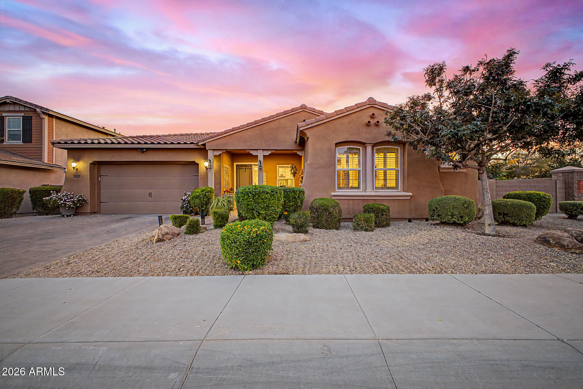 Stunning single-story home on a desirable corner lot! Fall in love with the exceptional curb appeal, easy-care landscaping, welcoming porch, & energy-saving solar panels. Delightful interior showcases tile flooring, neutral paint, recessed lighting, plantation shutters, surround sound speakers, & an open den for an office or flex space. Elegant formal living & dining rooms provide the ideal setting for entertaining, while the spacious family room features a media niche. The beautifully designed eat-in kitchen has a huge center island for prep & breakfast bar, granite counters, SS appliances, subway tile backsplash, white cabinetry, walk-in pantry, & butler's service area. Retreat to the luxurious main suite boasting private backyard access & spa-inspired bathroom. Dual vanities, soaking tub, glass-enclosed shower, & generous walk-in closet! A Jack & Jill bathroom, a bonus room, & functional mudroom add flexibility. Discover a laundry room showcasing built-in cabinets & a utility sink! The impressive exterior continues with a 3-car tandem garage, paver driveway, & a resort-style backyard. Relax beneath the covered patio w/retractable shades, take a dip in the sparkling pool & spa combo, entertain under the ramada w/built-in BBQ, rinse off in the outdoor shower, & enjoy the beauty of artificial turf. See it, love it, live it!