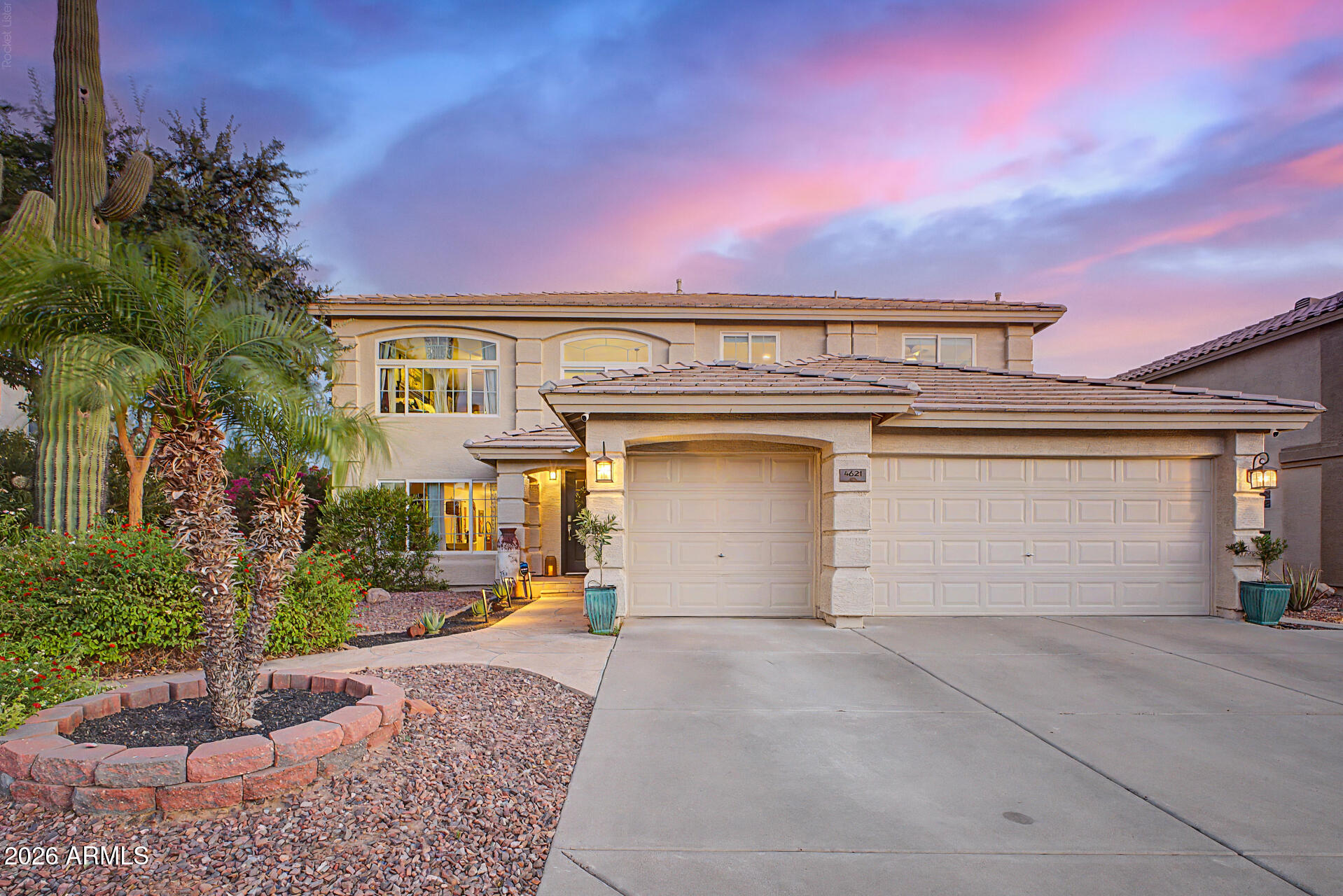 Nestled within the highly sought after gated community of Diamond Creek in Cave Creek, this beautifully updated 3,258-square-foot residence offers five bedrooms, a spacious loft and three full bathrooms. A welcoming foyer opens to elegant formal living and dining rooms, flowing seamlessly into the inviting family room with a stunning wrap-around fireplace. The updated chef's kitchen features crisp white cabinetry, quartz countertops, a custom tiled backsplash, breakfast bar seating, island with an exotic wood top, and abundant natural light from the expansive sliding glass door leading to the backyard. A private downstairs bedroom with en-suite bath and walk-in closet provides the perfect space for guests or multigenerational living.  At the top of a sweeping staircase is a generous loft, complemented by three guest bedrooms and a full hall bathroom.  The luxurious primary suite offers a wrap-around fireplace, private balcony, spa-inspired bath with soaking tub, shower with custom glass enclosure, dual vanity and a large walk-in closet. The resort-style backyard is a private oasis, featuring a relaxing covered patio, sparkling pool with custom tile, mature landscaping and a tranquil shade tree. Ideally located just minutes from the town of Cave Creek, Desert Ridge, City North, premier shopping, dining, schools, recreation, world-class golf and easy freeway access,  this exceptional Diamond Creek home delivers the perfect blend of comfort, elegance, and convenience!