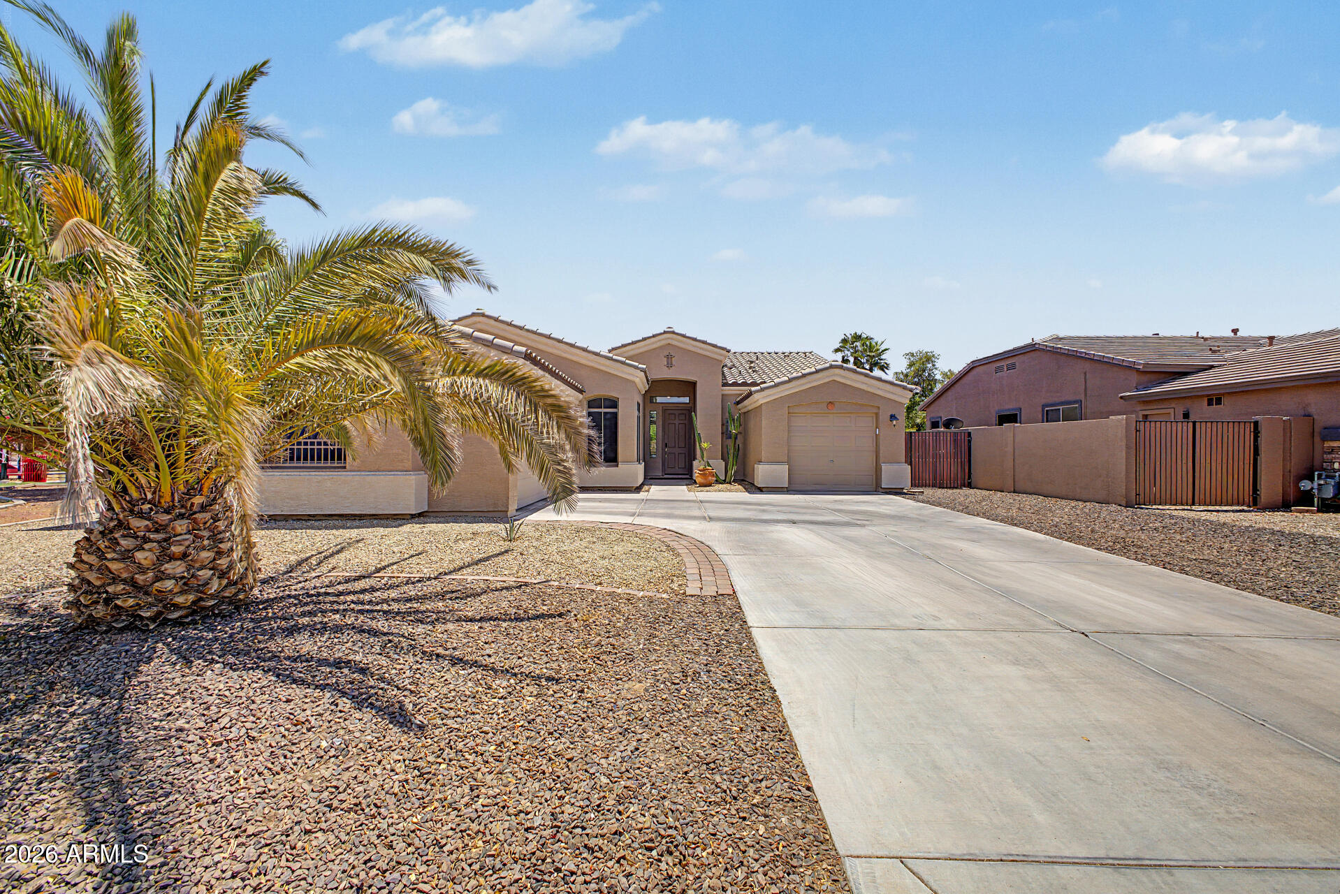 Resort-style living in this beautiful 4-bedroom, 2-bath single-level home with 1,949 sq. ft. of bright, comfortable living space on a premium lot next to the neighborhood children's playground. Over $100k in improvements, this home has been thoughtfully upgraded from curb to backyard. Enjoy an open, flowing floor plan with elegant tile flooring and abundant natural light. The kitchen features white cabinetry, stainless steel appliances, designer tile backsplash, quartz countertops, and a large center island. Dining and family rooms open seamlessly to the backyard for ideal indoor-outdoor living. Outside, enjoy a sparkling pool, covered patio, low-maintenance turf, and desert landscaping. Added plus, 2-car and 1-car garages with RV gate access for vehicles, toys, storage, or a workshop.