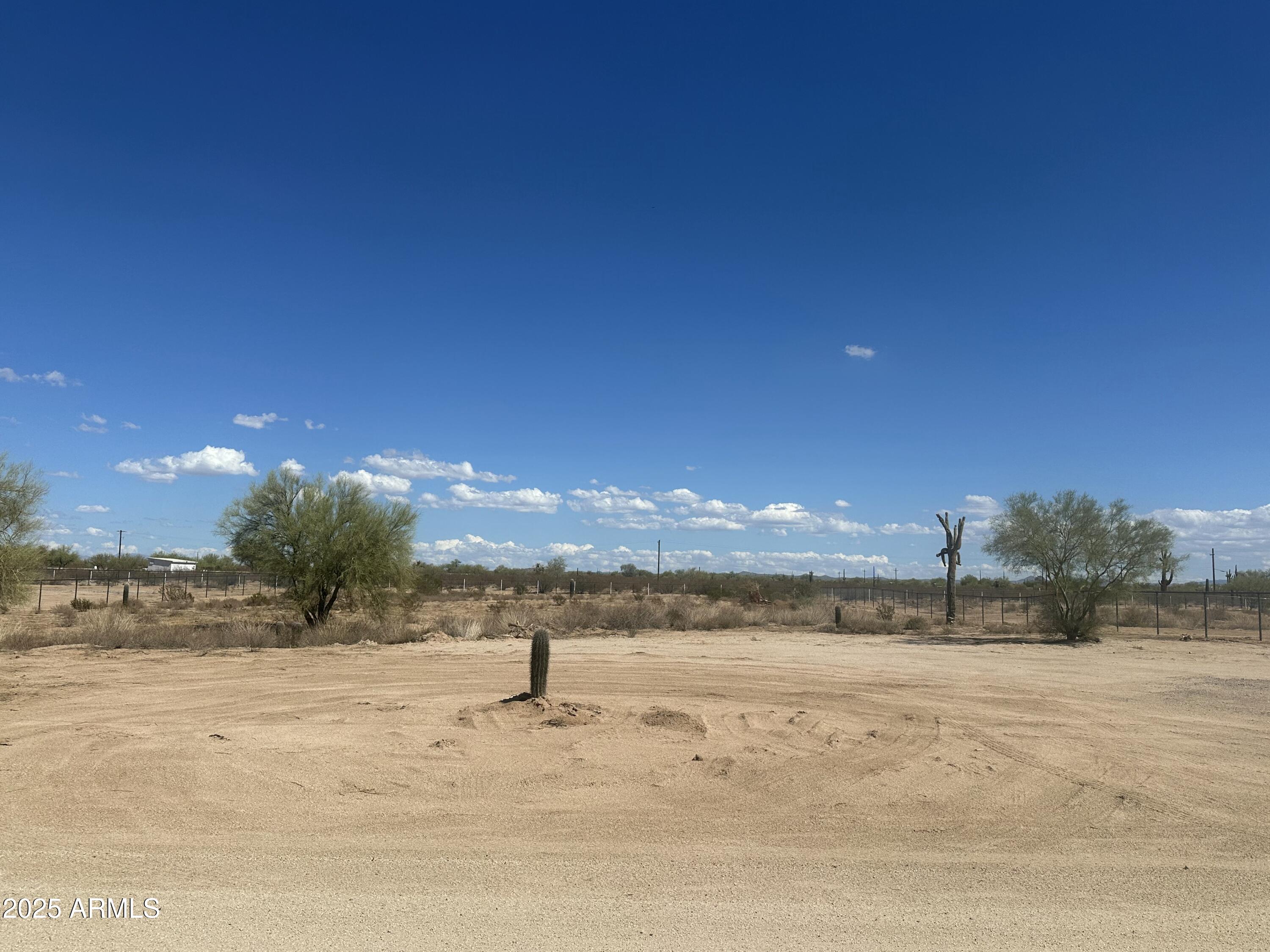 Build your home on this 1.26-acre lot in the popular Cactus Forest area. Lot is fenced on 3 sides with San Carlos Irrigation (SCIP) electric power to the corner of the lot.  New shared well with 3000-gallon storage tank already in operation.  Wide 32' road gives easy access to the property. Come create your dream and enjoy quiet beautiful sunrises/sunsets and plenty of space for your animals and toys.