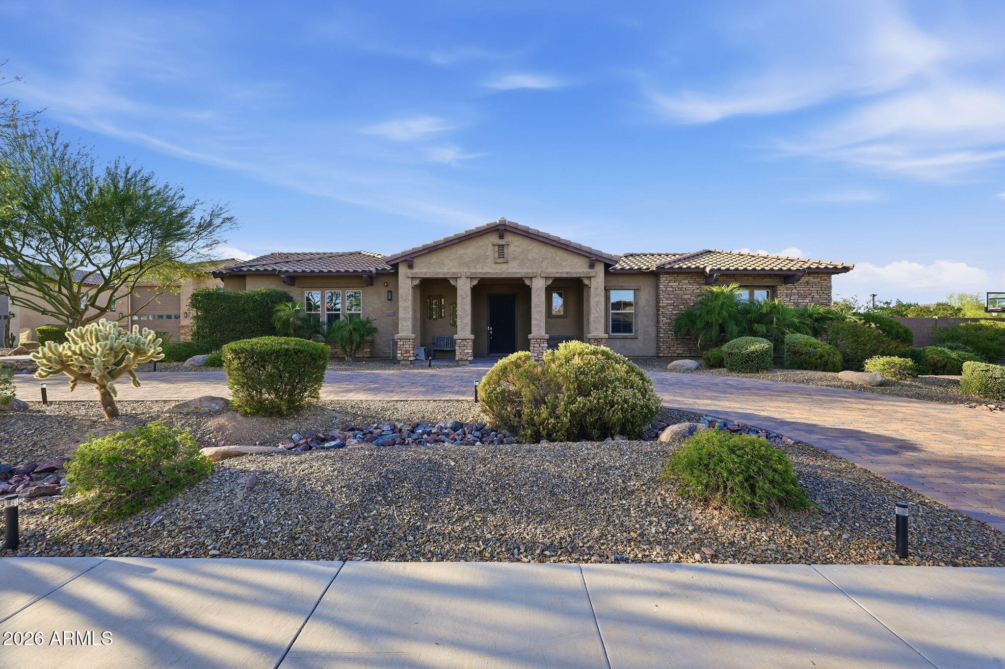 Experience refined desert luxury in this exceptional custom estate located within the exclusive gated community of Vista Montana. Privately positioned on an expansive corner homesite, this residence blends sophisticated design with effortless indoor-outdoor living. A grand courtyard entry welcomes you into a home appointed with top-tier finishes, designer details, and thoughtfully curated living spaces throughout. The resort-inspired grounds feature premium artificial turf for a lush, low-maintenance landscape year-round, along with a private sport court ideal for recreation and entertaining. An oversized RV garage and two detached guest casitas provide unmatched versatility for multi-generational living, executive office space, or private guest accommodations Just minutes from the best shopping, dining, and the outdoor recreation of Lake Pleasant Regional Park, this is elevated Arizona living at its finest.