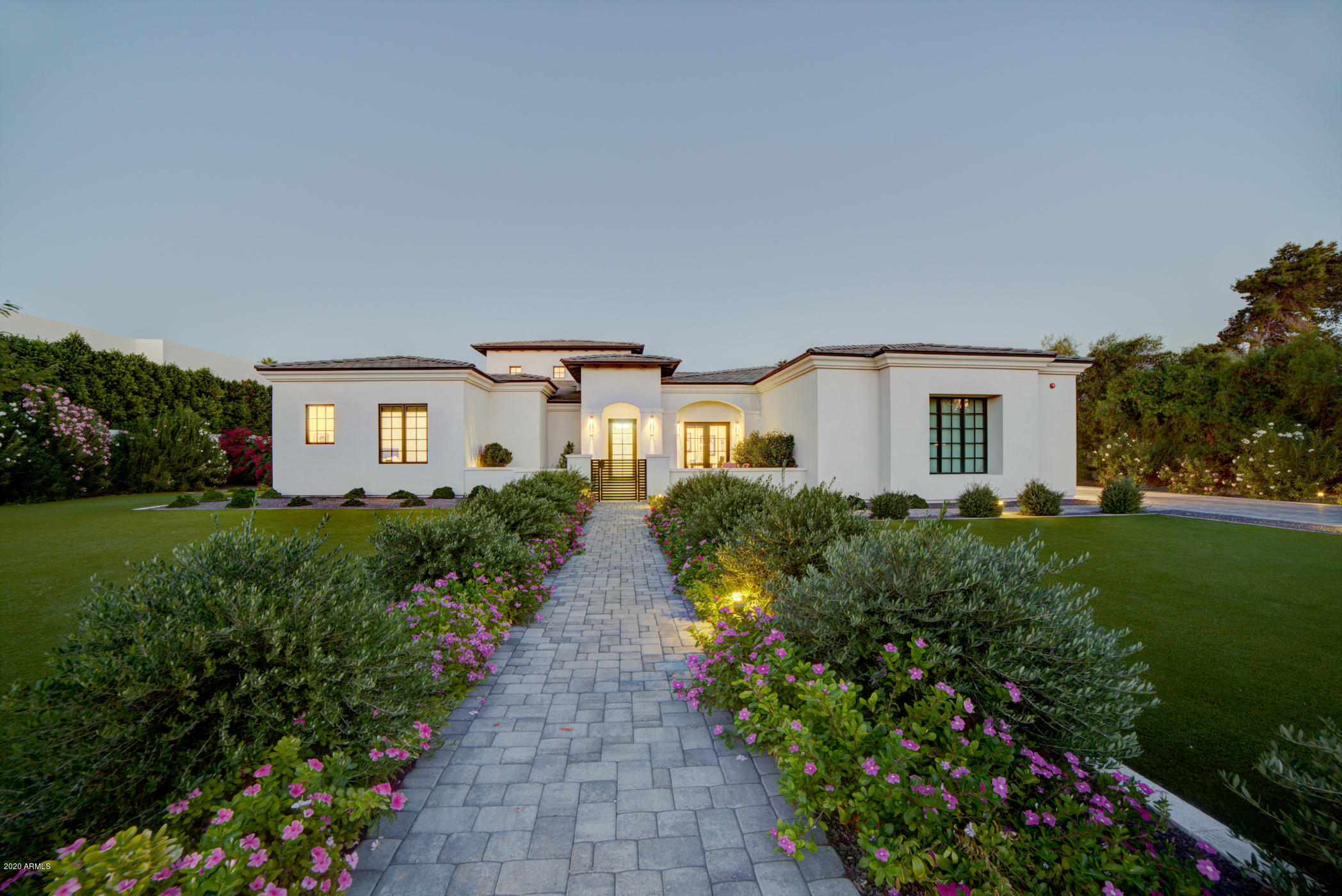 Look no further than this stunning custom 2018 new build and professionally designed masterpiece, in a quiet sought after cul de sac, walking distance to Fashion square and Old Town!  Built by Regal American homes this estate epitomizes 365 days a year of indoor/outdoor living with misting and heating systems.  Enjoy staring at Camelback 
Mountain from your beautiful front patio or step into your resort like backyard with stunning pool and Baha custom shelves.  The 5 beds include a split Master with access to a covered patio with sitting area, fire pit, & electronic black out shades. Relax in your above ground jacuzzi right off the huge master bath. Enjoy guest quarters with separate entrance, 450 square foot custom gym with half bath, 4 car extra deep garage, and a theater! A must see with too many details to mention like, state of the art Control 4 automated smart system, soaring 24 foot ceilings, moldings, sky lights, butler's and walk in pantry, wine fridge, just to name a few. Don't miss out on this entertainer's dream home!