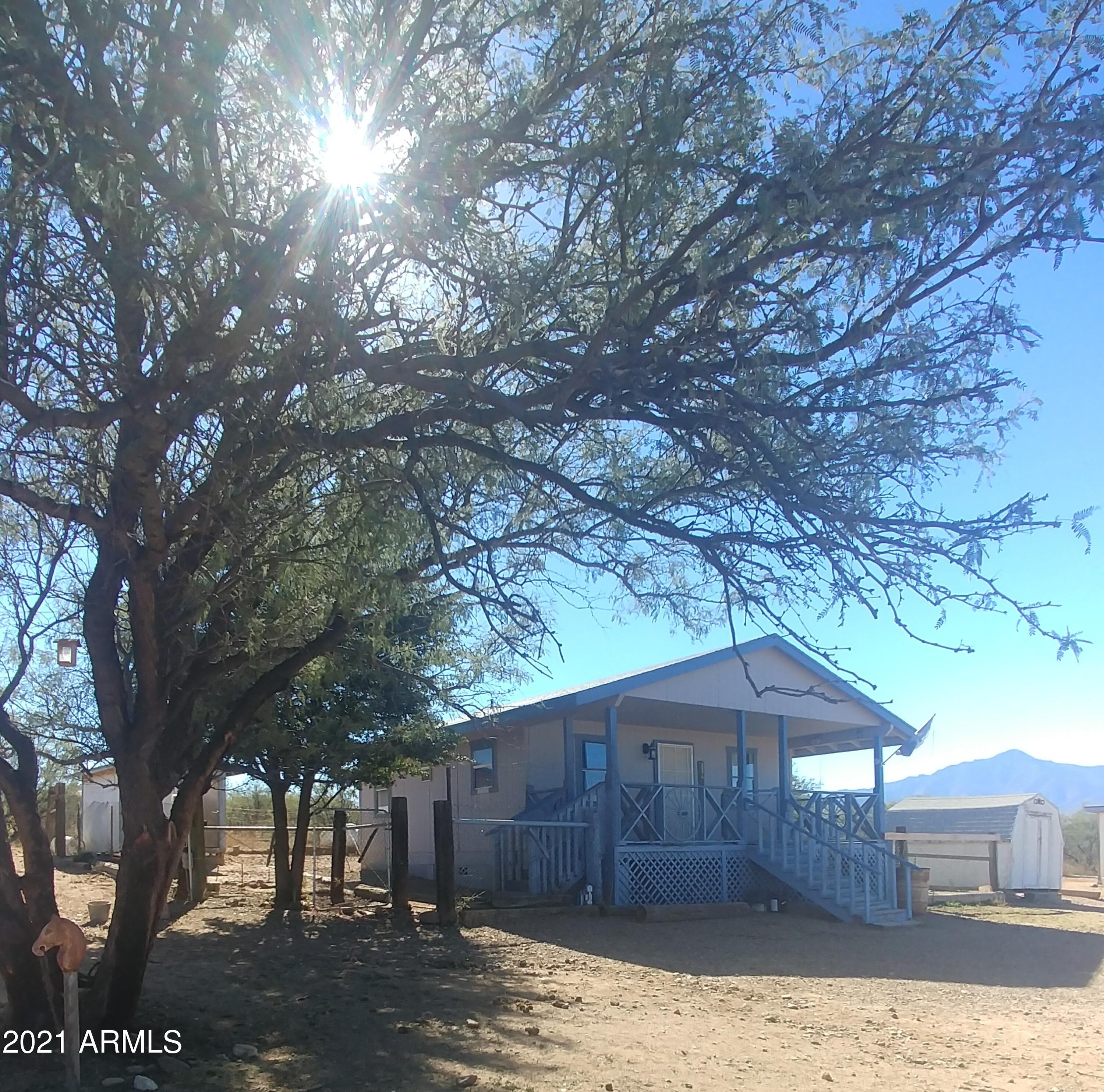 Quintessential, 4 acre Hereford, Arizona HORSE PROPERTY. Has several small, shady mesquite groves, sandy wash and diverse arroyo terrain to ride on. Riding distance to the San Pedro Riparian Area. Property is fenced with 2 horse stalls,  Come with your sleeves rolled up, the house and property both need work and we have priced it accordingly. Please confirm with Cochise County that the small square footage of the existing house will allow a larger house to be built here also! Although this is horse property, anyone would enjoy the features of this property...........more Laundry room is exterior access. Heat is wall mount unit. Home has been cooled by a window mount unit in the past but there is none at this time.