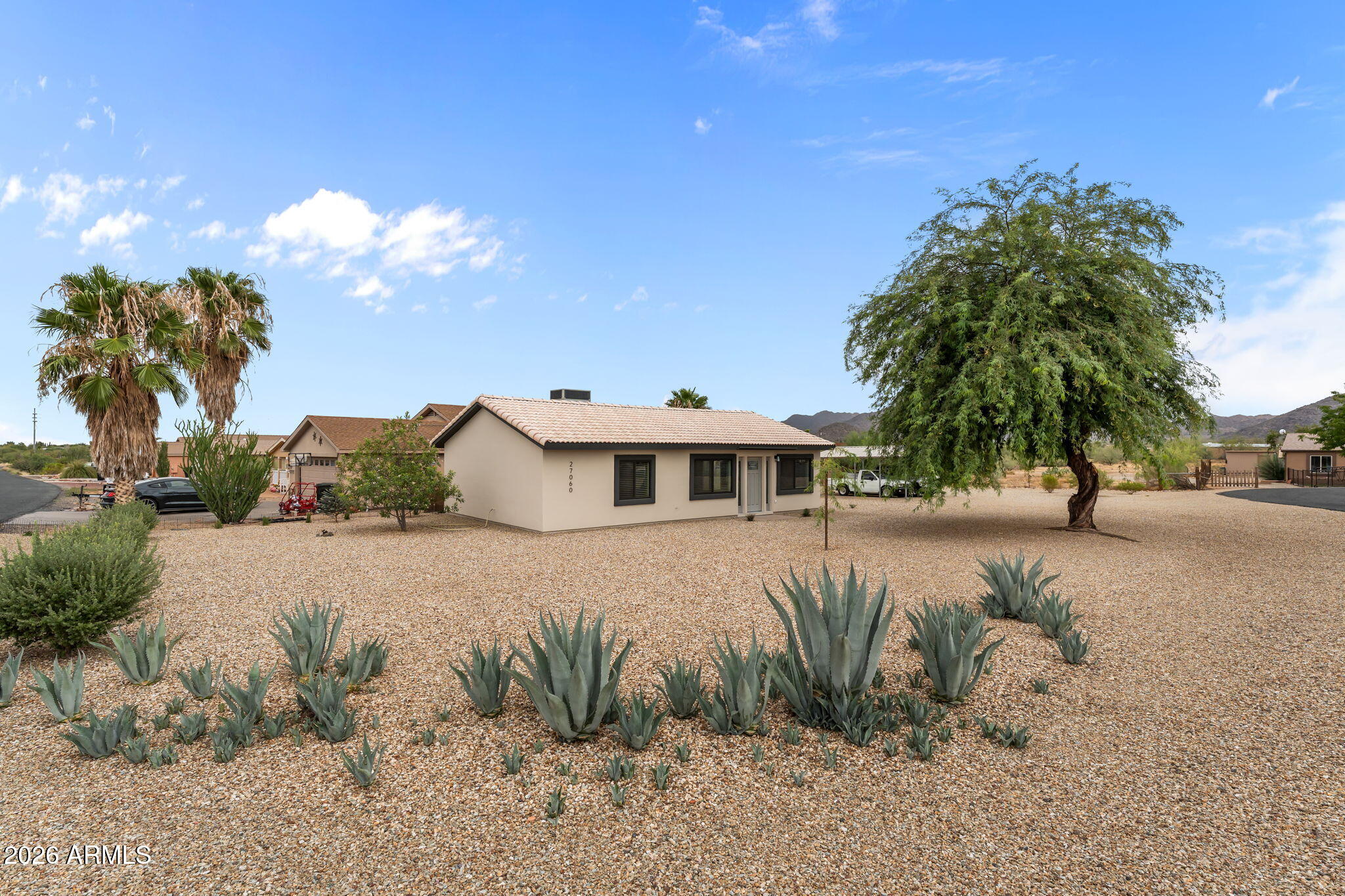 Located in the sweet community of Congress.  Easy drive to Wickenburg or Prescott. Enjoy the AMAZING mountain views . No HOA! Large corner lot. Very well kept. This is a beautiful 2 bedroom, 2 bath home..  You will feel like you are walking into a MODEL home. Completely remodeled. New windows, paint,-inside and out,, completely new kitchen starting from cabinets, Stainless Steel appliances, wood countertops,. New French doors exit from the kitchen. Lovely livingroom with real wood beams, high ceilings & lots of natural light. All new vinyl flooring throughout. 2 new bathrooms.  1 with a walkin shower.  Fully landscaped with rock, cactus and plants. Mature, beautiful provides shade over the front yard. 2 car (18x20) permitted American Steel Metal carport. Tool shed. Come take a look!!!