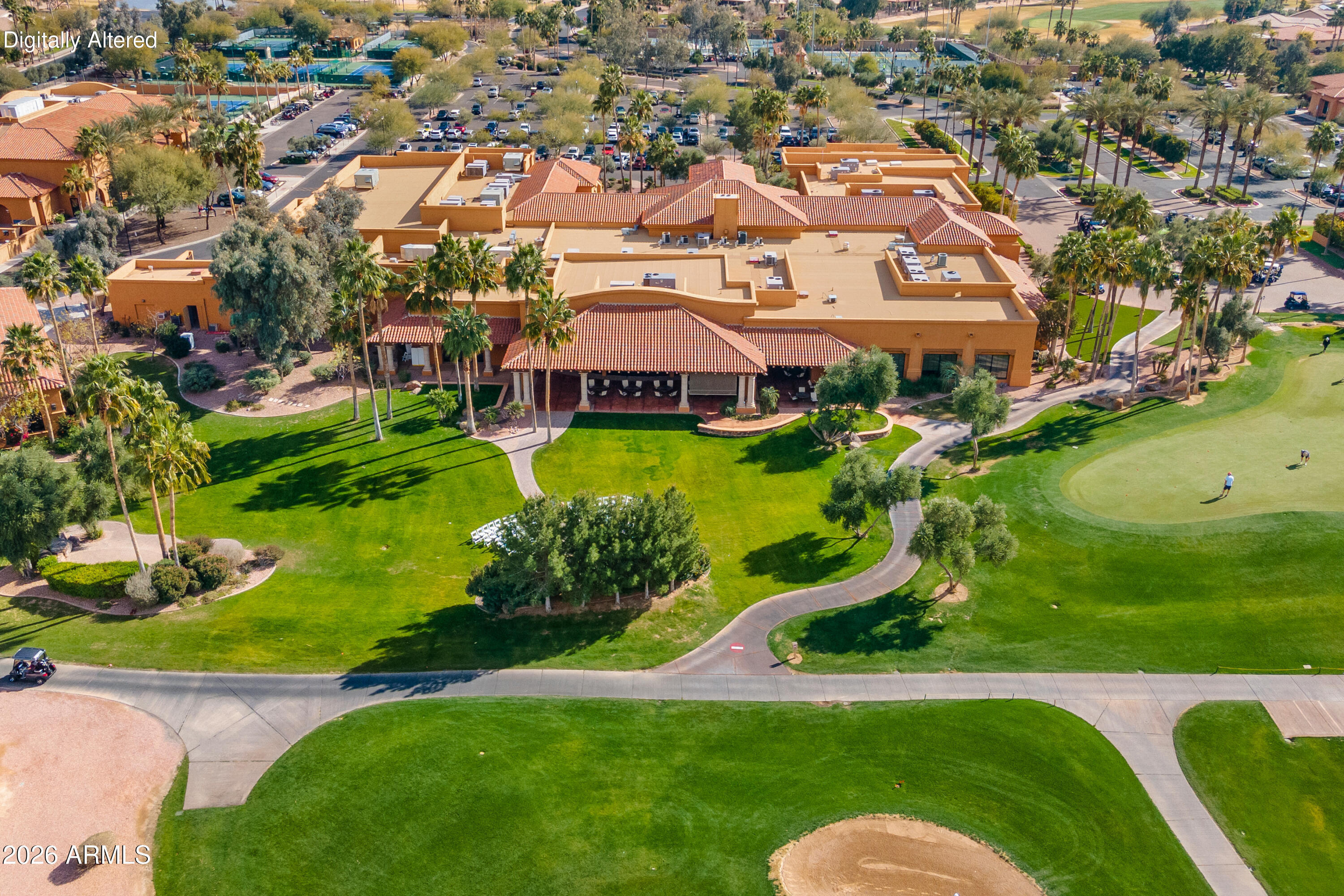 Experience resort-style living in this beautifully appointed Laguna model located in the highly sought-after community of PebbleCreek. Perfectly positioned on two golf fairways, this exceptional home captures breathtaking mountain and sunset views from expansive windows designed to bring the outdoors in.

The open-concept floor plan offers both comfort and functionality, featuring rich alder cabinetry with pull-out shelving, granite countertops, and a spacious pantry in the well-equipped kitchen. A convenient built-in workstation just off the kitchen creates the perfect space for managing daily tasks or working from home. The inviting living area includes a custom entertainment center designed to accommodate a large television, making it ideal for relaxing or entertaining. Wake up to stunning golf course views in the spacious primary suite, complete with a large picture window, dual vanity sinks, step-in shower with bench seating, and an oversized walk-in closet. Guests will enjoy their own private suite with a full bath and walk-in closet.

Step outside to the extended patio where you can enjoy Arizona evenings around the cozy fire hearth with built-in bench seating and ample space for alfresco dining while taking in the spectacular scenery.

The extended garage adds an additional four feet of space and includes built-in storage cabinets for added convenience.

Offered fully furnished--including kitchen utensils, small appliances, linens, and three televisions--this move-in ready home truly allows you to simply bring your clothes and start enjoying the incredible PebbleCreek lifestyle.
