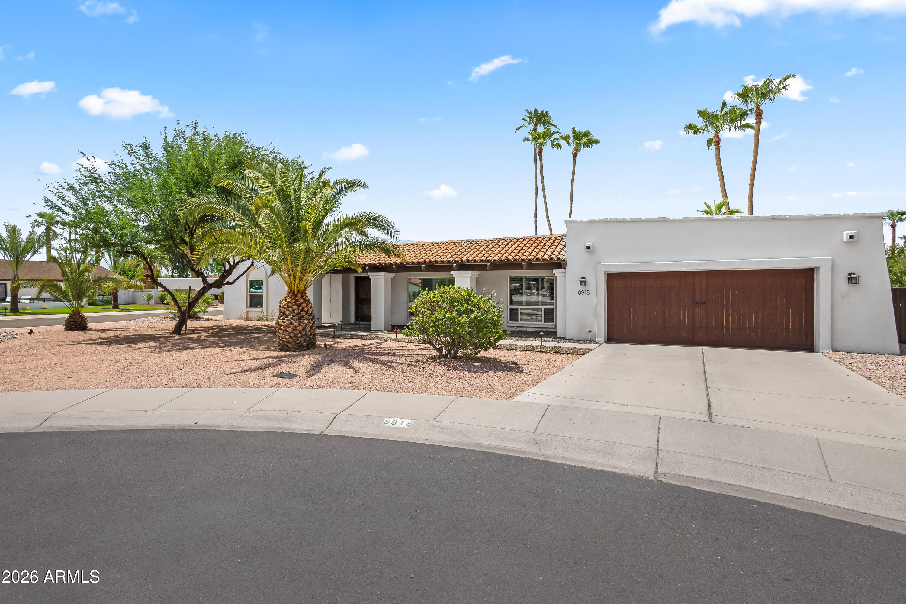 Nestled on an expansive north/south-facing cul-de-sac lot in the heart of highly sought-after McCormick Ranch, this spacious 4-bedroom, 3-bathroom home offers the perfect blend of comfort, functionality, and Arizona outdoor living. A welcoming curb appeal and thoughtfully designed floor plan provide multiple living and entertaining spaces, including a bright living room, inviting family room, and an open kitchen complete with granite countertops, stainless steel appliances, an oversized pantry, and a casual dining area.
The generously sized primary suite serves as a private retreat with direct access to the backyard, a spacious ensuite bath with dual sinks, and a custom walk-in closet. A separate guest suite features its own bathroom and backyard access, offering added privacy for visitor or multigenerational living. Step outside to the true showstopper--an extensively redesigned backyard built for enjoying Arizona's year-round sunshine. New travertine hardscaping, custom inlaid synthetic turf, lush low-maintenance landscaping, and a sparkling diving pool create a resort-inspired setting that's equally suited for entertaining or relaxing. A covered patio, built-in BBQ, and expansive outdoor living spaces make this backyard an extension of the home. Situated in one of Scottsdale's most desirable master-planned communities, enjoy miles of walking and biking paths, lakes, golf courses, parks, top-rated dining, shopping, and easy access to everything McCormick Ranch has to offer. This is an exceptional opportunity to own in one of Scottsdale's most iconic neighborhoods.