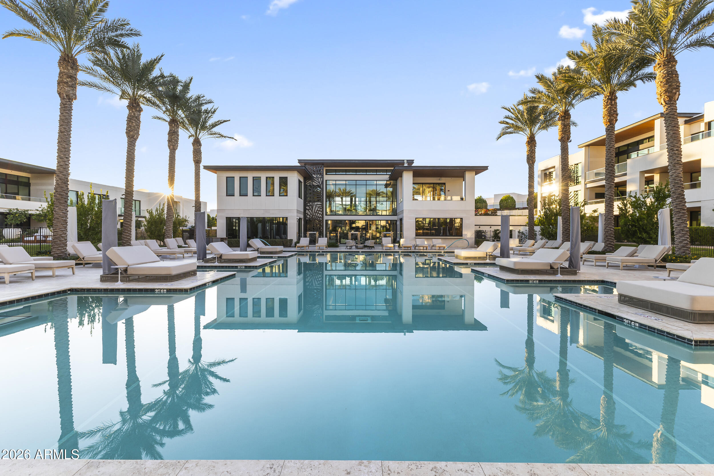 The Ritz-Carlton Residences set a high bar in Paradise Valley. This 3 bed, 3.5 bath second-floor villa offers 3,202 sq. ft. of polished space. The open layout flows with ease. So does the light. Large-format tile, Taj Mahal counters and backsplash, walnut cabinetry, floating vanities, designer accents, and WOLF appliances sharpen the interiors. Crestron audio/video, power shades, custom closets, 10-foot ceilings, and expansive windows keep things elevated. The large terrace brings an outdoor fireplace, courtyard views, water features, and a strong sense of calm. Second-floor placement adds privacy. Inside, every finish feels deliberate. Villa owners also enjoy private pool, fitness center, movement studio, demonstration kitchen, social spaces, and lush gardens. Branded luxury. Done RIGHT.