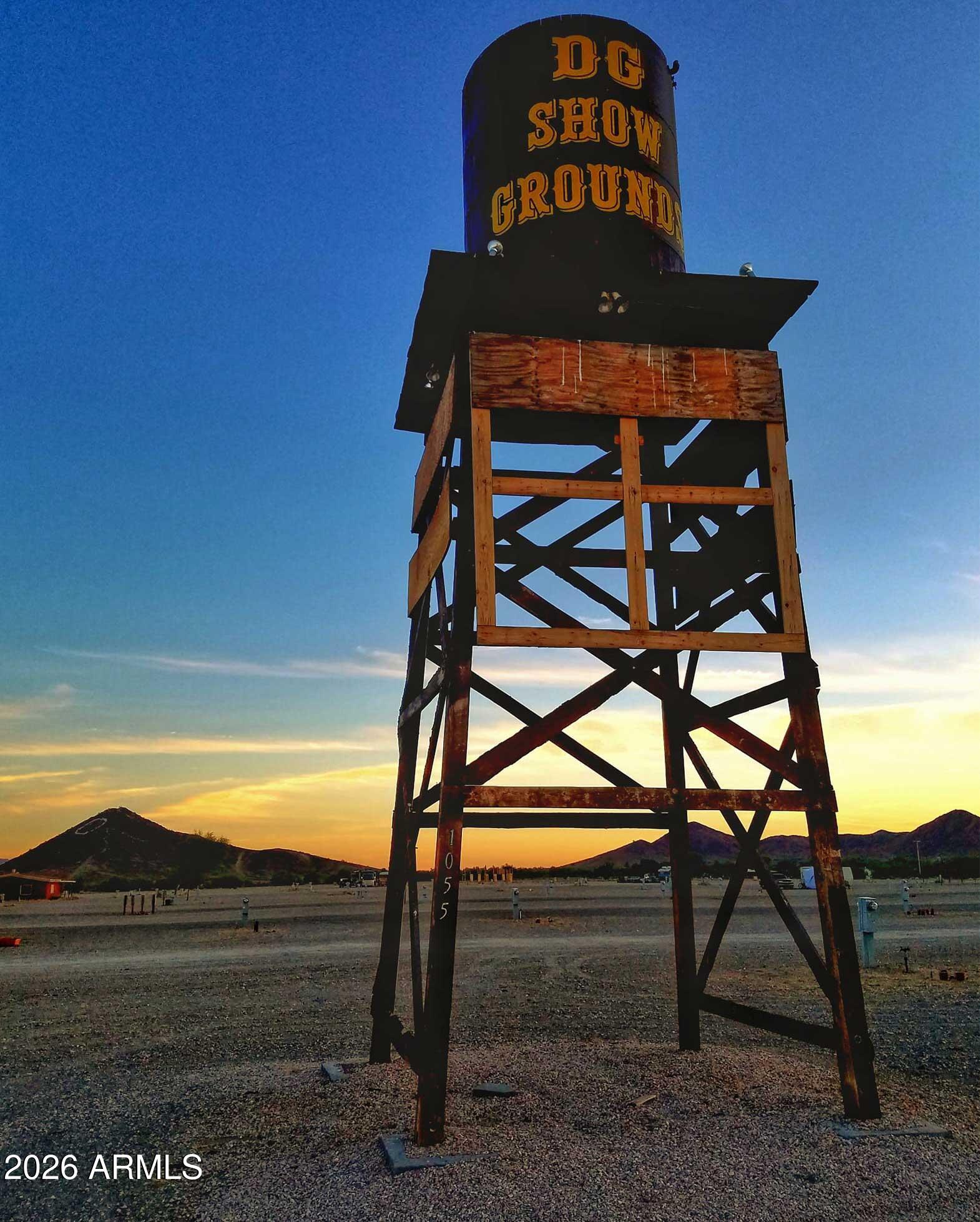 Desert Gardens Int'l Rock, Gem & Mineral Showgrounds - Featured in Oscar Award-Winning ''Nomadland.'' Prime 75± acre commercial site along I-10 in Quartzsite, AZ with 270 full-hookup RV stalls (30/50 amp), 55 Dry Camping spaces, restrooms/showers, Town water/sewer and APS electric. Each winter, nearly 2 million visitors and tens of thousands of RV enthusiasts & vendors flock to Quartzsite for the renowned Rock, Gem & Mineral Show.  45+ acres of vacant land behind the Showgrounds for expansion - Mobile Home/RV Park, multi-family, or other commercial use.  Borders BLM land.  Passive Income with Property Manager located on-site.  2025 Revenue of $331,447 with Income before Taxes of $159,000.  CAP Rate of 4.5.  The Showgrounds is open October to April each year.  Year around RV storage. BIG ANNOUNCEMENT! Go to Projects at ADOT. Click on Southwest District Projects. New $75m overpass at Exit 17 being constructed over the next 3 years. More traffic. More trucks. More people.