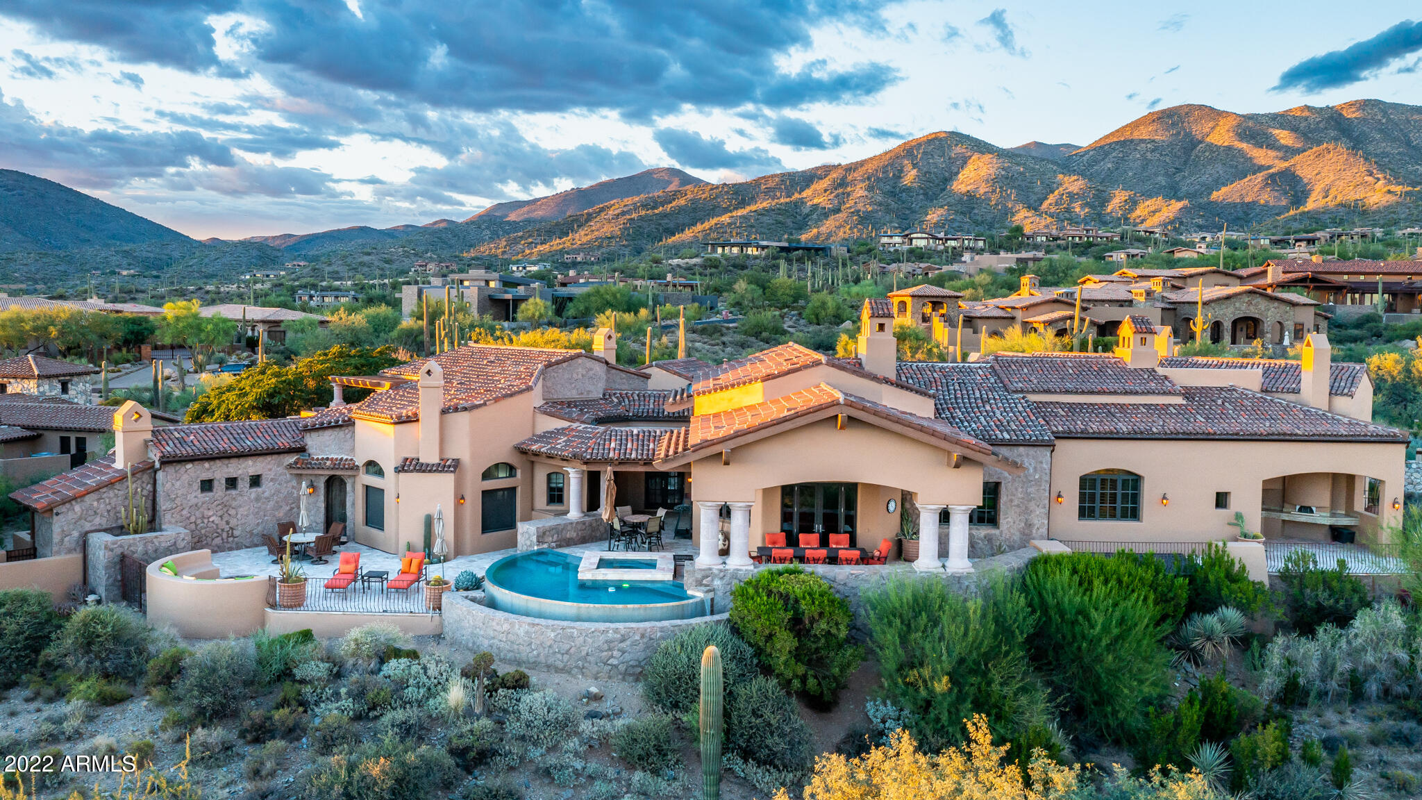 Beautiful Italian style estate located on 9th fairway of the Chiricahua golf course in the prestigious golf community of Desert Mountain. Panoramic views  of golf course, mountains, sunsets and city lights. The Full GOLF Membership is Available at close of escrow with a pre approval from the DM Club.
Three bedroom ensuites in main house with 2 1/2 baths, office, and separate guest casita with their own covered patio and Outside Fireplace. 
Lots of charm and quality throughout, brick barrel ceilings in entry, dining and kitchen, Mahogany , travertine and carpeted flooring. Limestone Fireplaces, Negative edge pool and Spa