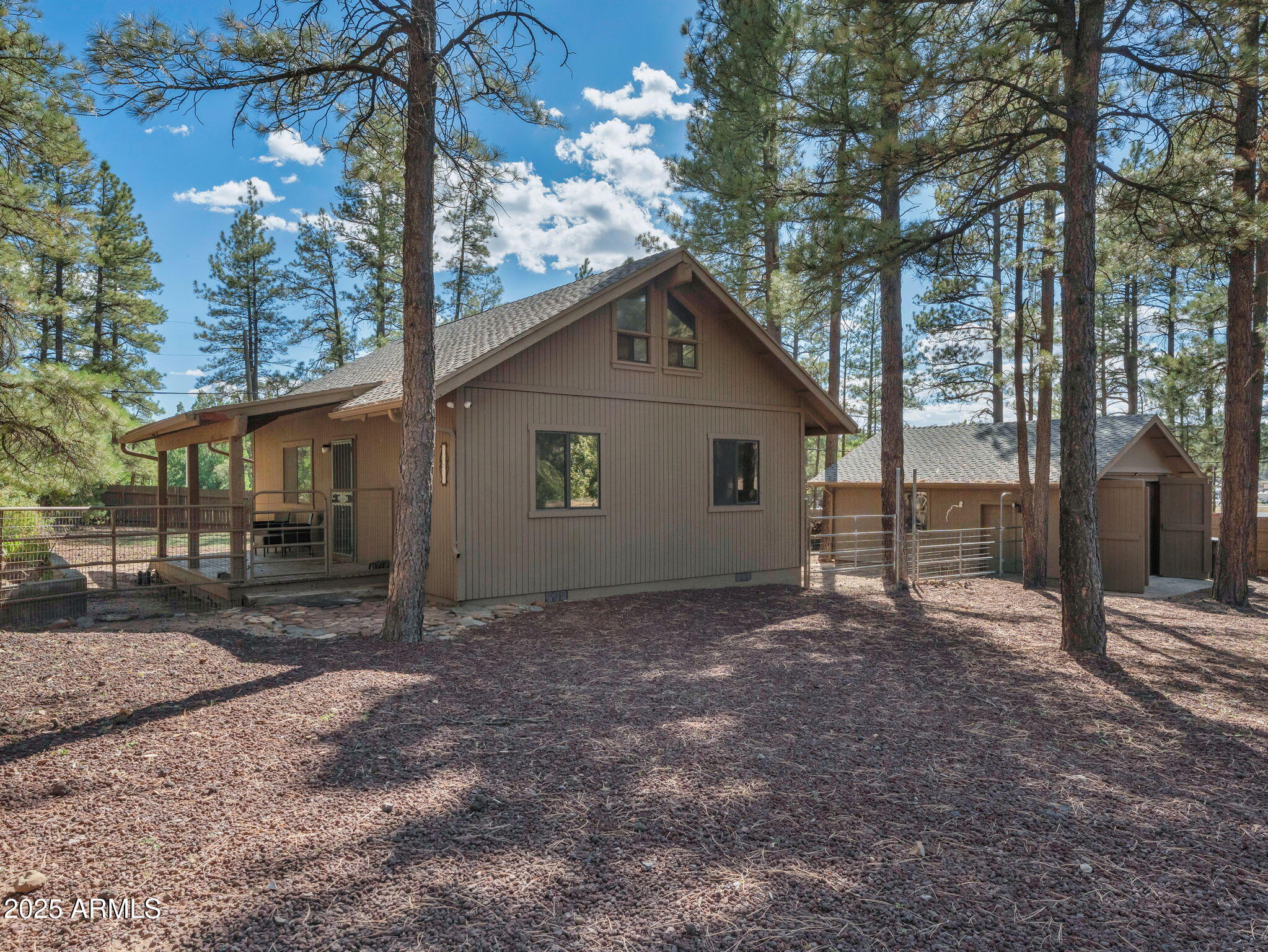 Welcome to one of Munds Park's most exceptional offerings--a beautifully updated cabin nestled among towering pines on a rare, nearly 0.4-acre lot. This private retreat offers the perfect blend of rustic charm and modern comfort with 2 bedrooms, 2 bathrooms, and thoughtfully designed renovations throughout. The inviting open living area features new flooring and tinted windows for added comfort and energy efficiency, while the beautifully renovated bathroom adds a fresh, contemporary touch. Outside, enjoy the spacious lot with room to relax, entertain, or simply take in the peaceful mountain setting. Complete with a detached garage and move-in ready condition, this turnkey cabin is a rare opportunity to own your own escape in the heart of Munds Park.