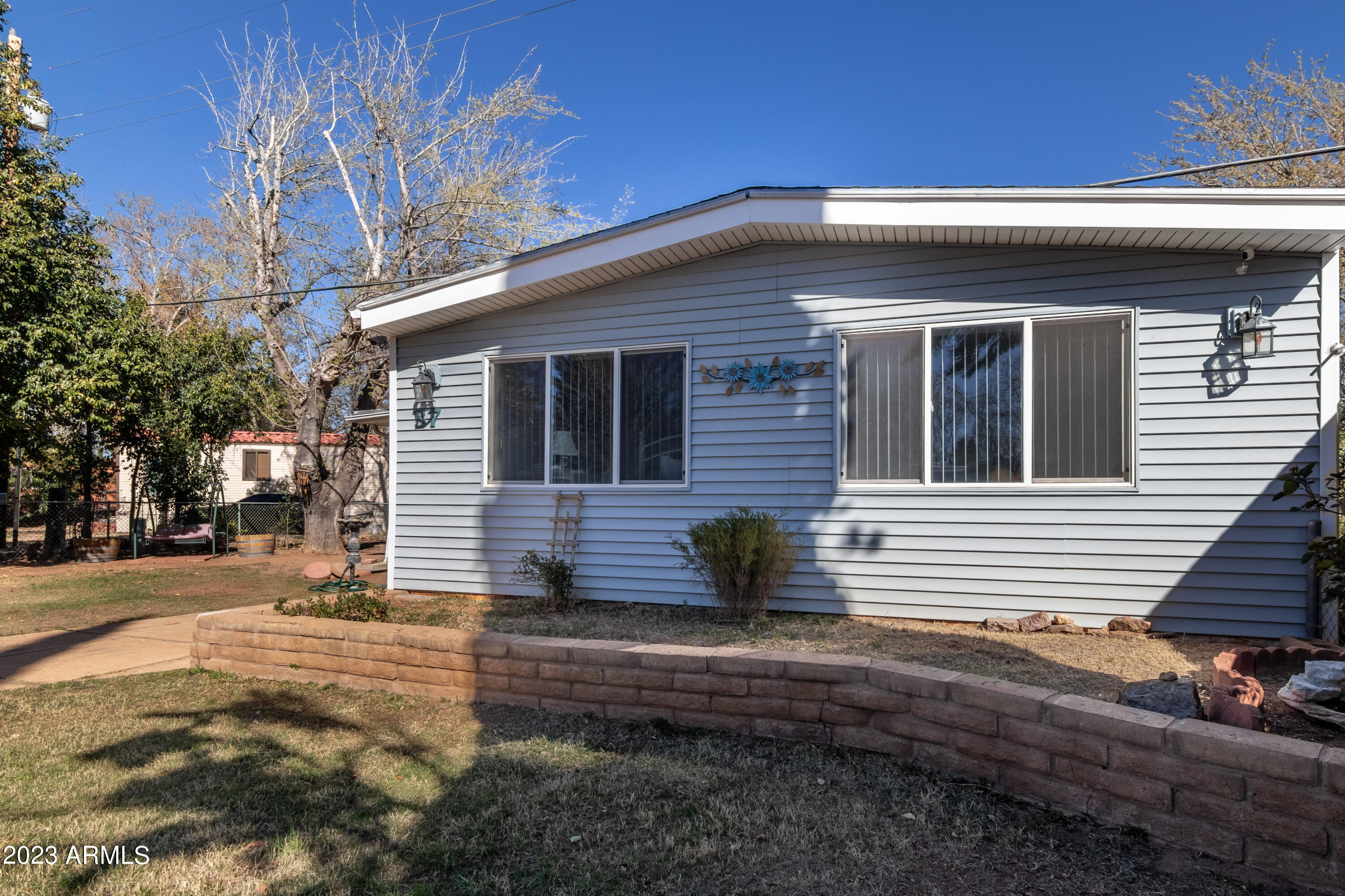 This is a large home with new carpet throughout, ceiling fans, dishwasher, gas stove, updated vanity and sink in main bathroom, vertical blinds, large screen porch and a large family room/den added on back of home, large lot, shed. Home is centrally located close to grocery stores, restaurants, Veterans Park across Fry Blvd., close to banks and businesses. Waiting for new owners.
