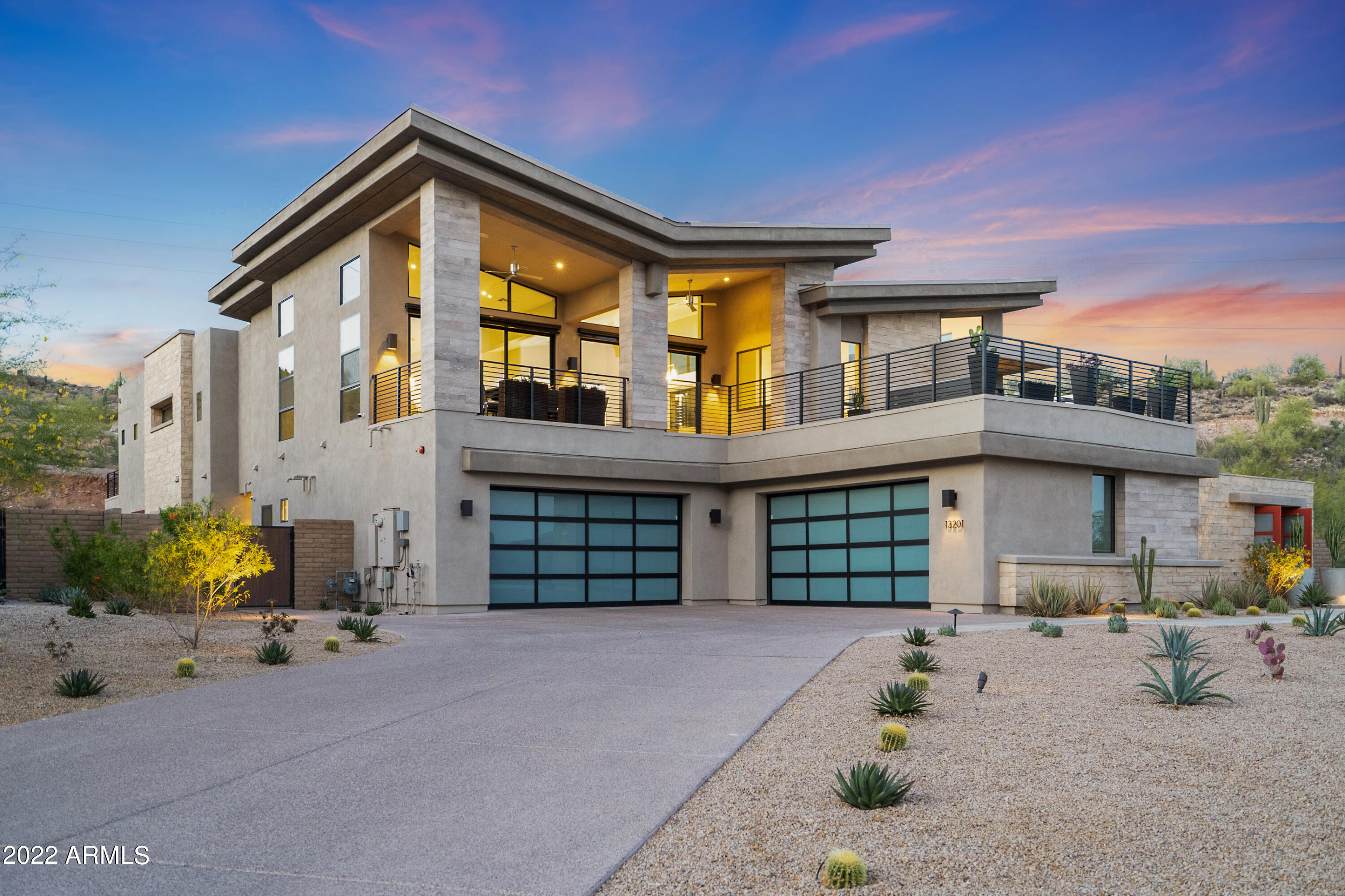 Over 5000 square feet of livable space with elevated finishes throughout. Perfect for entertaining, this home features a stunning 13+ft quartzite waterfall island with LED lighting, 530-Bottle temperature controlled custom wine wall, Subzero/Wolf appliances, two-story elevator with wood flooring and Gucci wallpaper, multiple terraces showcase panoramic views, putting green, spacious casita, modern pebble-tec pool with build-in BBQ and poolside full bar complete with TV hookup, sink, dishwasher, Scotsman ice maker and sleek pre-lit shelving. The beautiful low-maintenance custom landscaping surrounds the property including travertine decking, turf, native plants, and spectacular lighting. Upstairs you will find the luxurious primary suite with double closets, oversized walk-in shower, private terrace that overlooks the pool area next to beautiful mountain views. Situated at the end of a cul-de-sac with only one neighbor to the north, this home is located near 30+ miles of hiking/biking trails, FireRock Country Club, and multiple golf courses. Modern desert living at its finest.