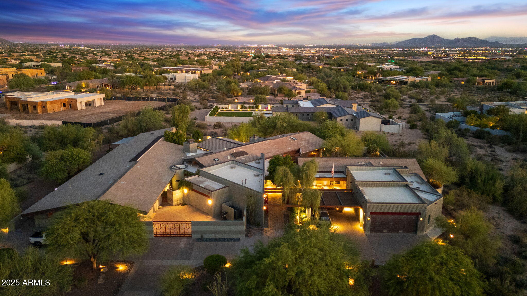 3 Homes in 1 Compound. Unmatched Value in 85255 Under $400/sqft!!!

Where else can you find three architecturally distinct residences on a privately gated 1.6-acre estate—with over 10,000 square feet, 8-car garage spaces, a green build, and breathtaking Mountain views—all in Scottsdale?

Designed by celebrated architect Barry Moffitt, this one-of-a-kind industrial-modern compound is a true fusion of form, function, and future-ready living. Purpose-built for multi-generational families, luxury investors, or those who desire separate private living quarters, the estate includes:


A 4-bed, 3.5-bath Main House with dramatic cedar ceilings and chef's kitchen with full butler's pantry.


A 3-bed, 3-bath East House with loft, private garage, and separate courtyard. A 2-bed, 2-bath West House ideal for extended-stay guests or a luxe home office retreat


Each residence has its own private entry, garage, and courtyard, creating a layout rarely found in Arizona luxury real estate.


In addition to its striking design, this property is also a certified green buildconstructed with sustainable materials and energy-efficient systems to reduce environmental impact and utility costs. Features like insulated block construction, and natural daylighting through skylights all contribute to long-term efficiency and eco-conscious living.


From the moment you arrive, the exposed steel beams, masonry block construction, and concrete pillars establish a striking visual identity. Skylights flood the interiors with natural light, while thoughtful N/S orientation enhances energy efficiency and frames iconic views of McDowell Mountains and the city skyline.

Whether you're a collector needing an oversized 8-car garage, a visionary buyer looking for flexible living, or simply someone who values world-class designthis estate is unlike anything else on the market.


A livable work of art. A compound built for legacy.