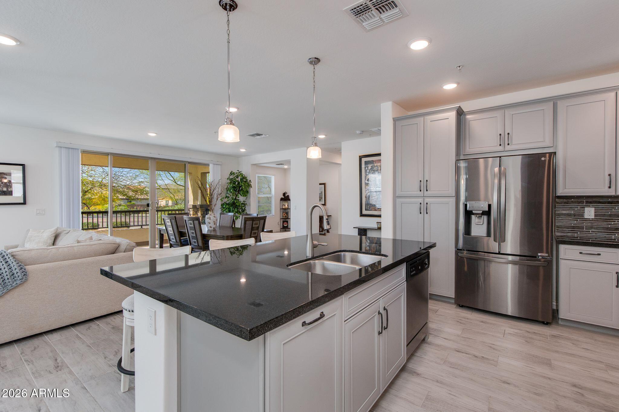 Built in 2018, this home blends modern finishes with functional design. The open-concept floor plan creates a seamless flow between the kitchen, dining, and living areas -- perfect for both everyday living and entertaining. The kitchen features stainless steel appliances, a spacious island ideal for gathering, and abundant cabinetry for storage. Tile flooring runs throughout the main living spaces, providing both durability and style, while the bedrooms offer plush carpet for added comfort.

A generous bonus room provides flexibility for a home office, media room, fitness space, or guest retreat -- ideal for today's evolving lifestyle needs. This thoughtfully designed living space is located in the sought-after Rancho North community.   Must See! Enjoy the convenience of low-maintenance condo living within a resort-style community featuring a pool, spa, and fitness center. Located in the desirable North Phoenix/Cave Creek area, you're just minutes from shopping, dining, golf, and outdoor recreation.

Modern comfort. Functional design. Exceptional location.
