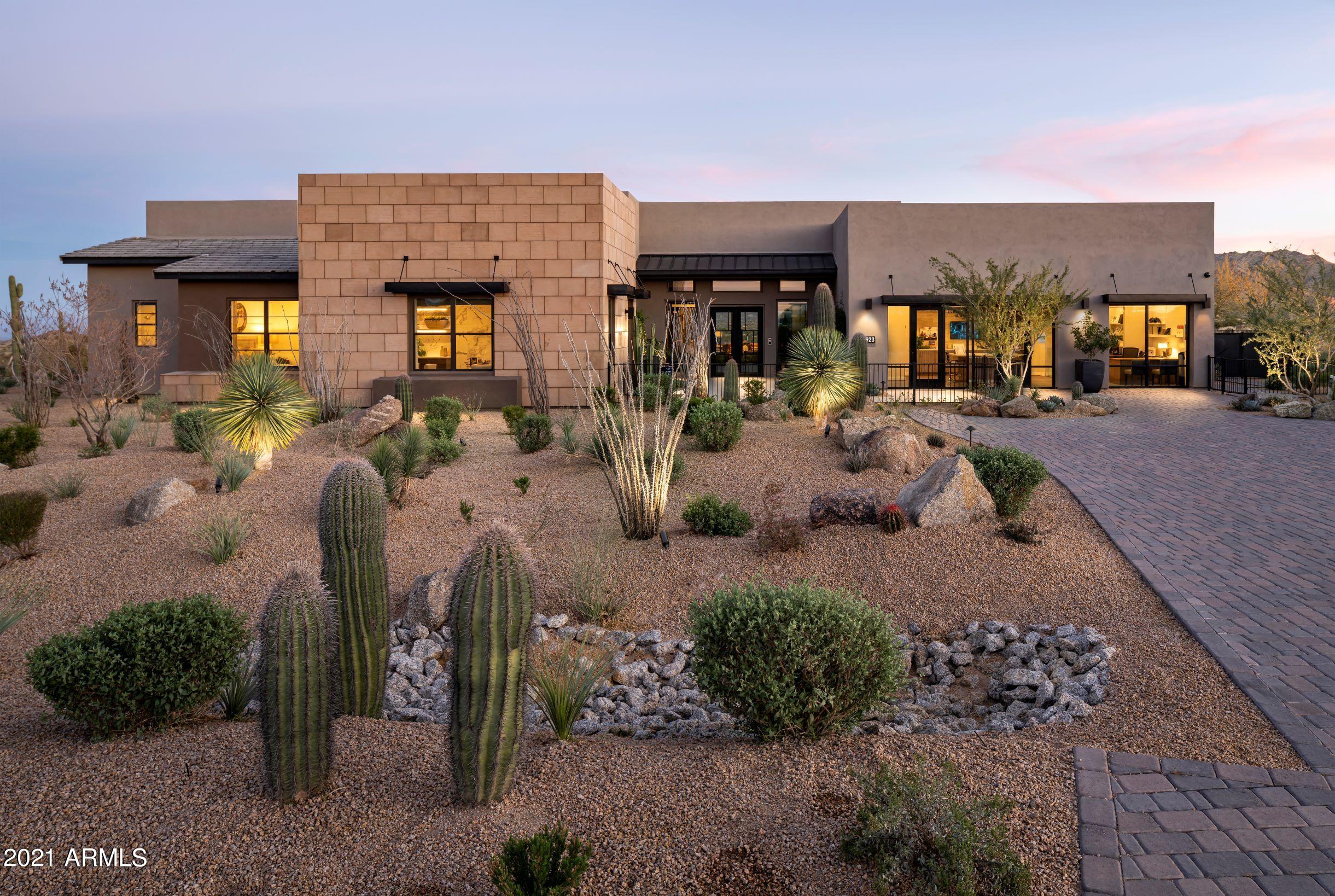 STUNNING MODEL HOME and AWARD-WINNING CONTEMPORARY DESIGN CAN BE YOURS at BOULDER RANCH in NORTH SCOTTSDALE! You'll enjoy oceans of mountain views from every direction in this Resort Style Home! We held nothing back! 1 pool,  , including negative edge, outdoor kitchen for dining under the stars and conversation areas for entertaining you won't be able to resist! Magnificent Model Home with 11 Mult-Slide doors that OPEN ENTIRE HOME TO THE OUTDOORS! The interior Courtyard, w/ Firepit surrounds you in peaceful Water features, garden open to the sky! A WINE ROOM, POOL HOUSE, CASITA for Guests and a even a MASSAGE ROOM for you! A home that pampers everyone! The Gourmet Kitchen, appointed with Sub-Zero and WOLF Appliances surrounded by a Waterfall Island standing alone, as a beautiful work of