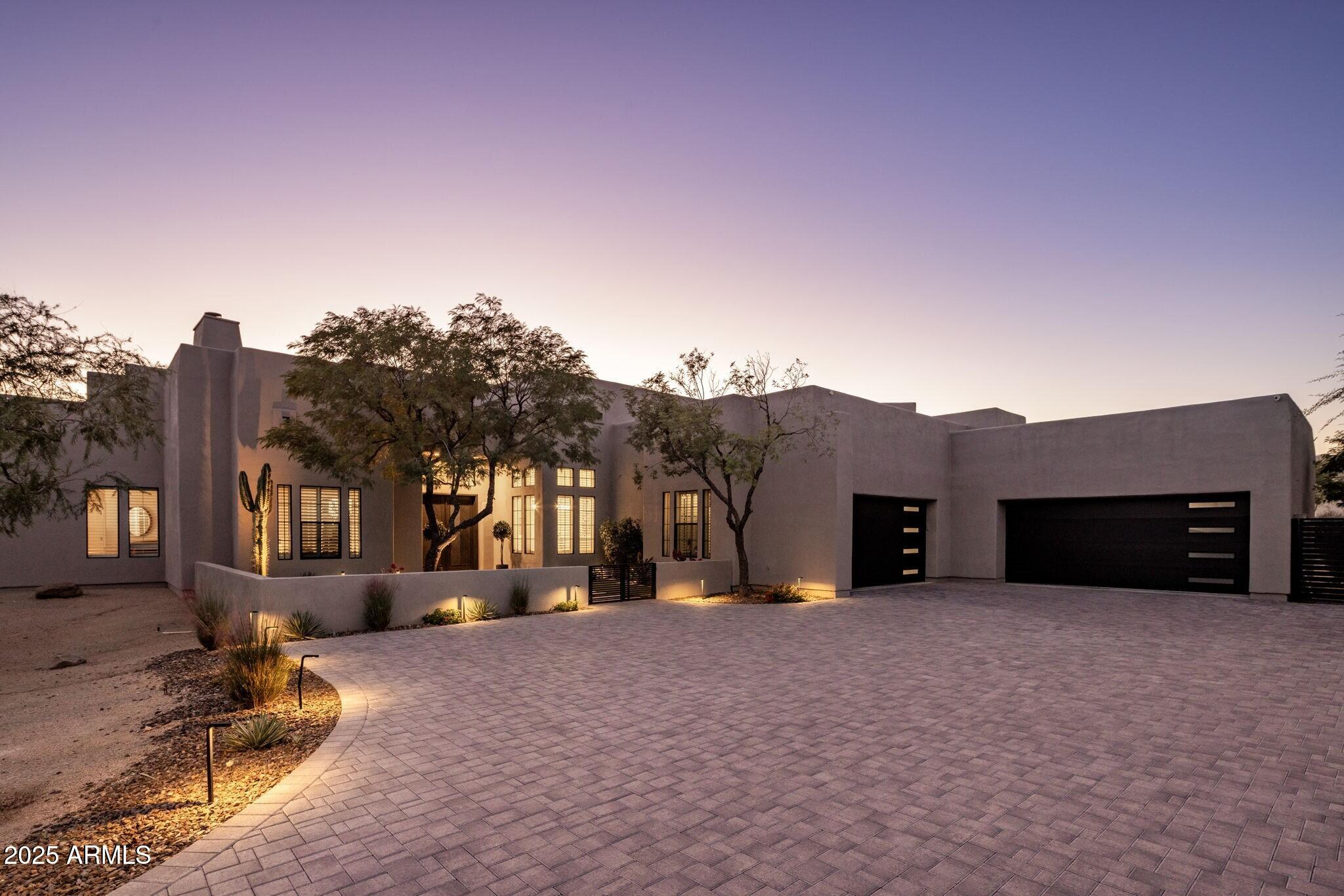 Situated in the highly sought-after Pinnacle Peak Vistas of North Scottsdale, this elegant single-level home offers 4 bedrooms plus a dedicated office and showcases the best of Arizona living. Designed for effortless indoor/outdoor entertaining, the residence features multiple outdoor living areas with firepits and panoramic city light and mountain views. Inside, expansive open living spaces, a chef's kitchen, and seamless flow to the outdoors create an inviting setting for both relaxed everyday living and sophisticated gatherings. With its elevated lot, refined finishes, and unbeatable location near Scottsdale's premier dining, golf, and hiking destinations, this home captures the essence of desert luxury.