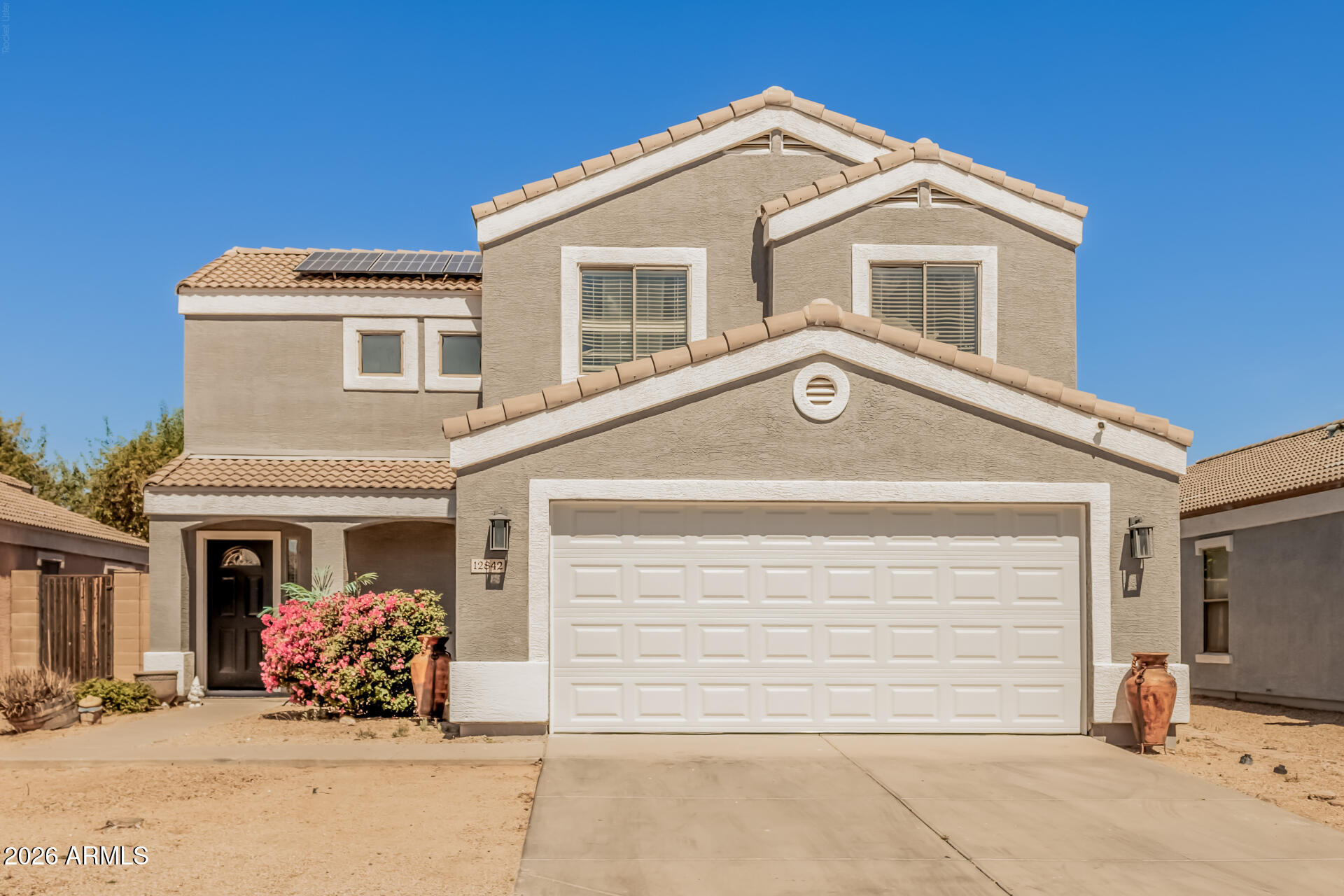 Move-in ready 4 bed, 2.5 bath home in El Mirage designed for comfort, convenience, and smart savings.

Open-concept layout with a spacious great room, custom interior paint, and a private primary suite with French doors, walk-in closet & bath. All stainless steel appliances included--plus washer & dryer for a true move-in ready experience.

Low-maintenance backyard with covered patio and mature fruit trees--fig, lemon, pomegranate & orange
Near the Hohokam Multi-Use Trail--perfect for walking & biking

Buyer Advantage: $10,000 seller credit

2-car garage | No HOA | Close to shopping, dining & freeway access