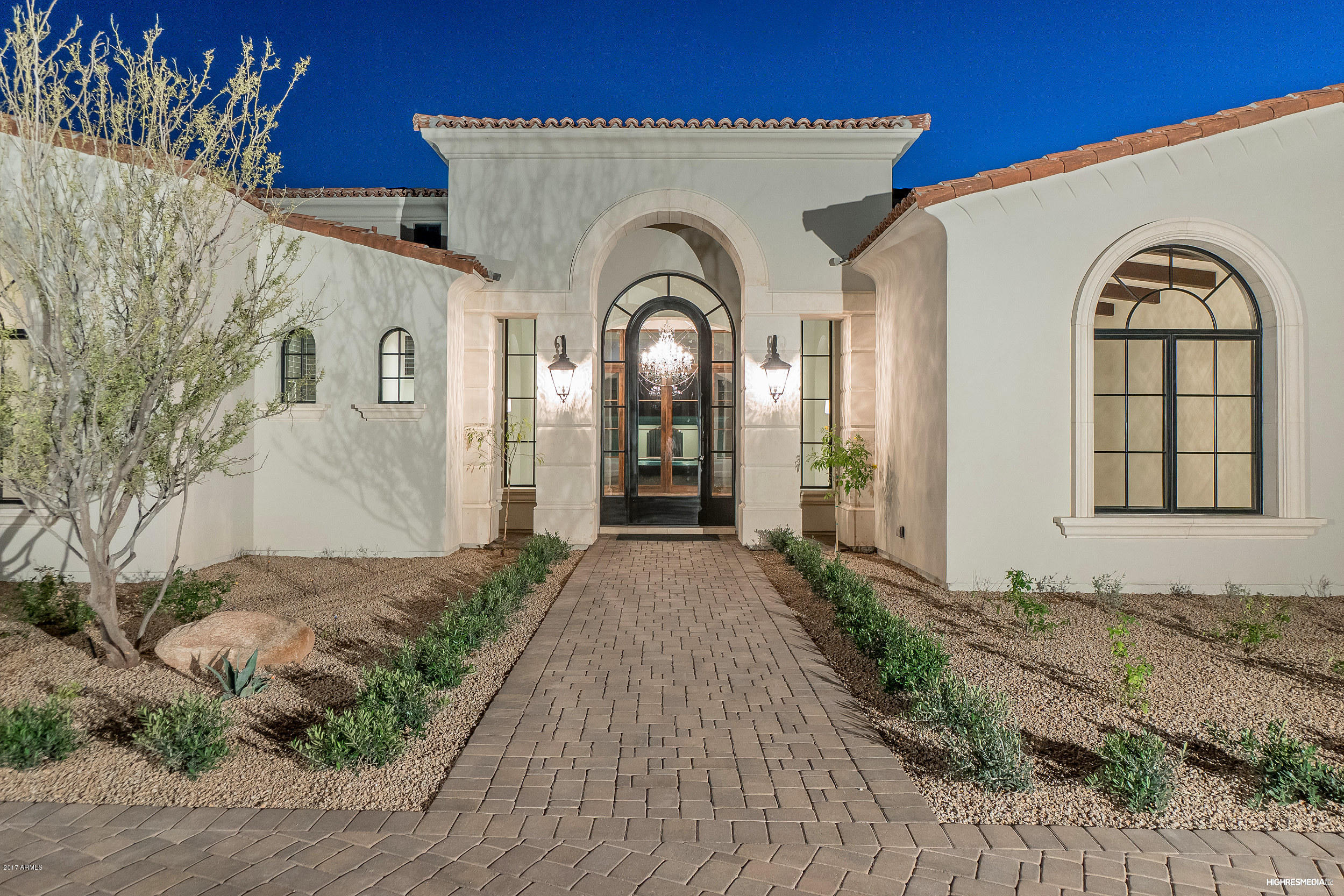 Simply Astonishing, this is a must see. Gated estate home on a large 1.25 acre lot with sprawling views of mummy mountain nestled on a quiet street. Open floor plan with breathtaking designer finishes seen throughout, nothing of its kind on the market. Main home has a large 5 car garage and guest home has its own single car garage. Guest home is hands down one of the best you will see. No expenses spared on landscaping the grounds with a resort pool and ramada. Pool features a shaded swim up bar. The main home features a large game room with a wet bar, large kitchen which accommodates 2-36'' fridges and 3 ovens, 2 powder bathrooms, detailed trim work seen throughout, 10' tall french doors one of which is a bifold door opening to the mountain views and resort style backyard.