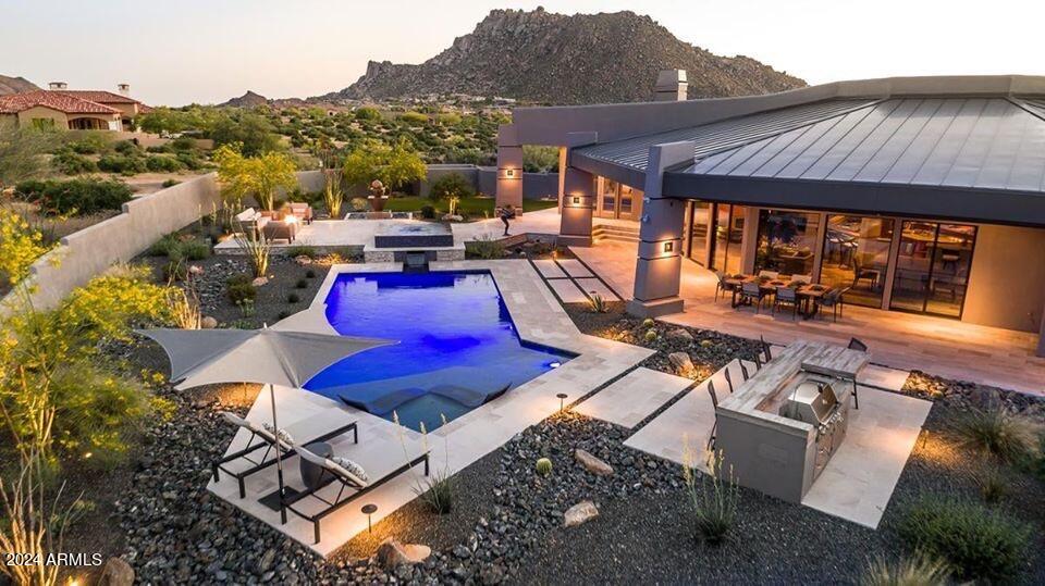 Stunning Contemporary home with views in all directions.   Walls of glass with open concept living that wraps around an amazing chef's kitchen.  Award winning  pool and backyard makes this property even more special.  Situated on a large lot gives you privacy and space to relax in this wonderfully updated home.