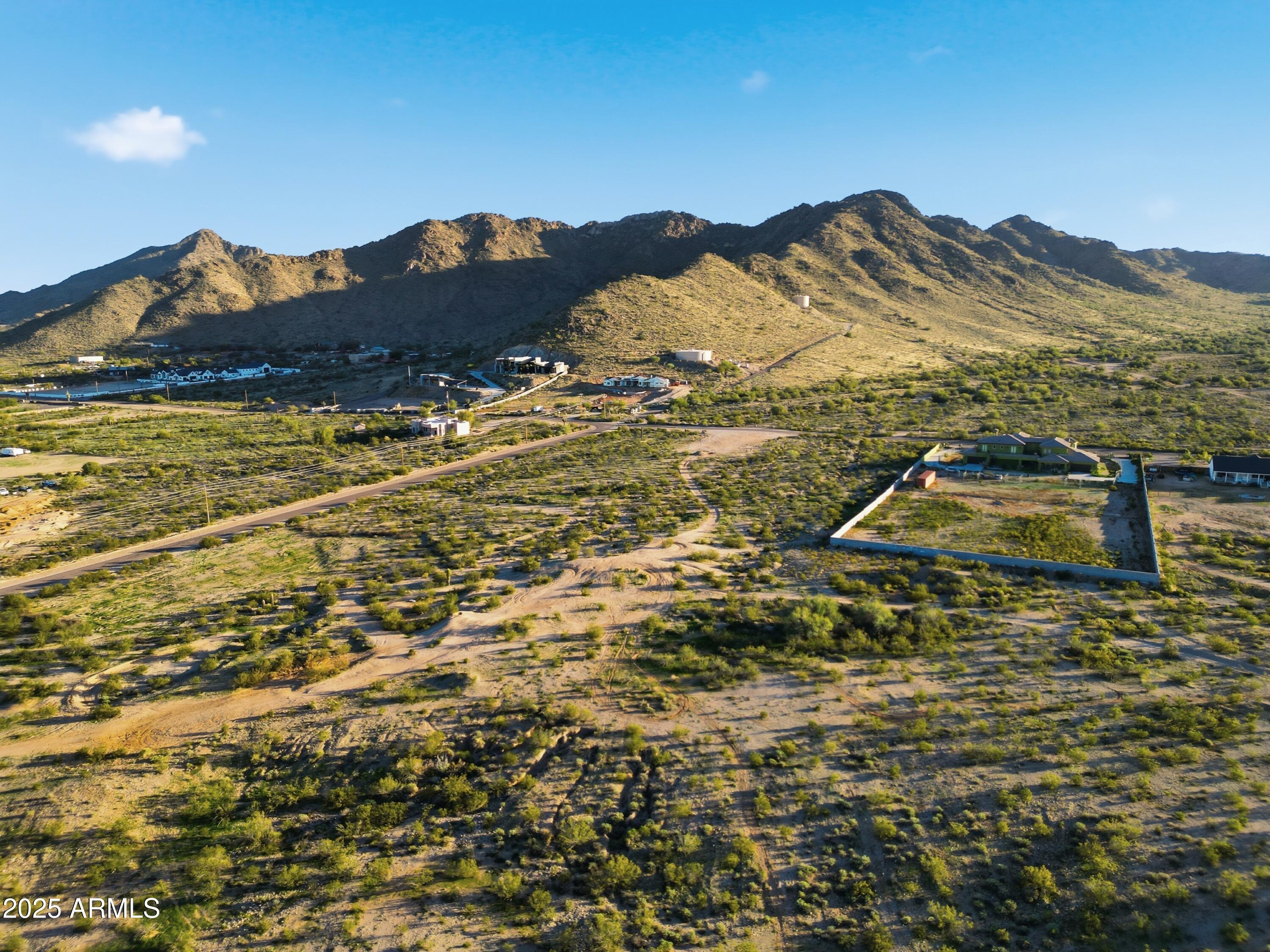 1.25 ACRES OF LUXURY LIVING-IN EXCLUSIVE NEW SOUTHEAST VALLEY COMMUNITY

Introducing an exceptional opportunity to build your custom dream home in one of the newest and most prestigious luxury neighborhoods.This 1.25 acre estate lot offers the perfect blend of elegance, privacy, and breathtaking scenery-ideal for those seeking a refined lifestyle in a serene, family-focused community.

Nestled in a quiet and peaceful setting, this expansive property showcases sweeping views of the sanTan Mountains and overlooks the sparkling  lights of Queen Creek creating an unmatched backdrop for luxury living. This gated neighborhood is designed with space, curated family amenities, and sophistication in mind, making it perfect for families.