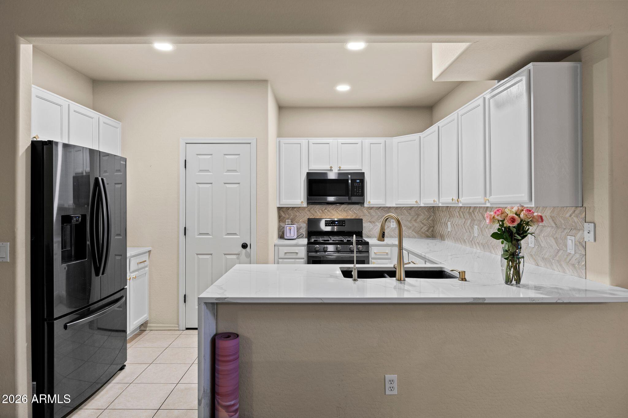 Beautifully updated townhome located in a gated community, offering modern finishes, functional design, and true MOVE-IN READY condition. This 3 bedroom, 2.5 bath home offers 1,385 sq ft with open layout and HIGH CEILINGS. Kitchen features QUARTZ COUNTERTOPS, GAS COOKTOP, STAINLESS STEEL APPLIANCES, WALK-IN PANTRY, and BREAKFAST BAR. Opens to great room with GAS FIREPLACE. All bedrooms upstairs. Primary suite includes REMODELED BATH with WALK-IN SHOWER and double vanity. UPSTAIRS LAUNDRY with storage. ATTACHED ONE-CAR GARAGE WITH DIRECT ENTRY. Low-maintenance living in a GATED COMMUNITY. Minutes to DOWNTOWN PRESCOTT, WATSON LAKE, TRAILS, RESTAURANTS, and SHOPPING. BACK ON MARKET - FRESH OPPORTUNITY. Under contract for 40 days. Now ready for the next buyer.