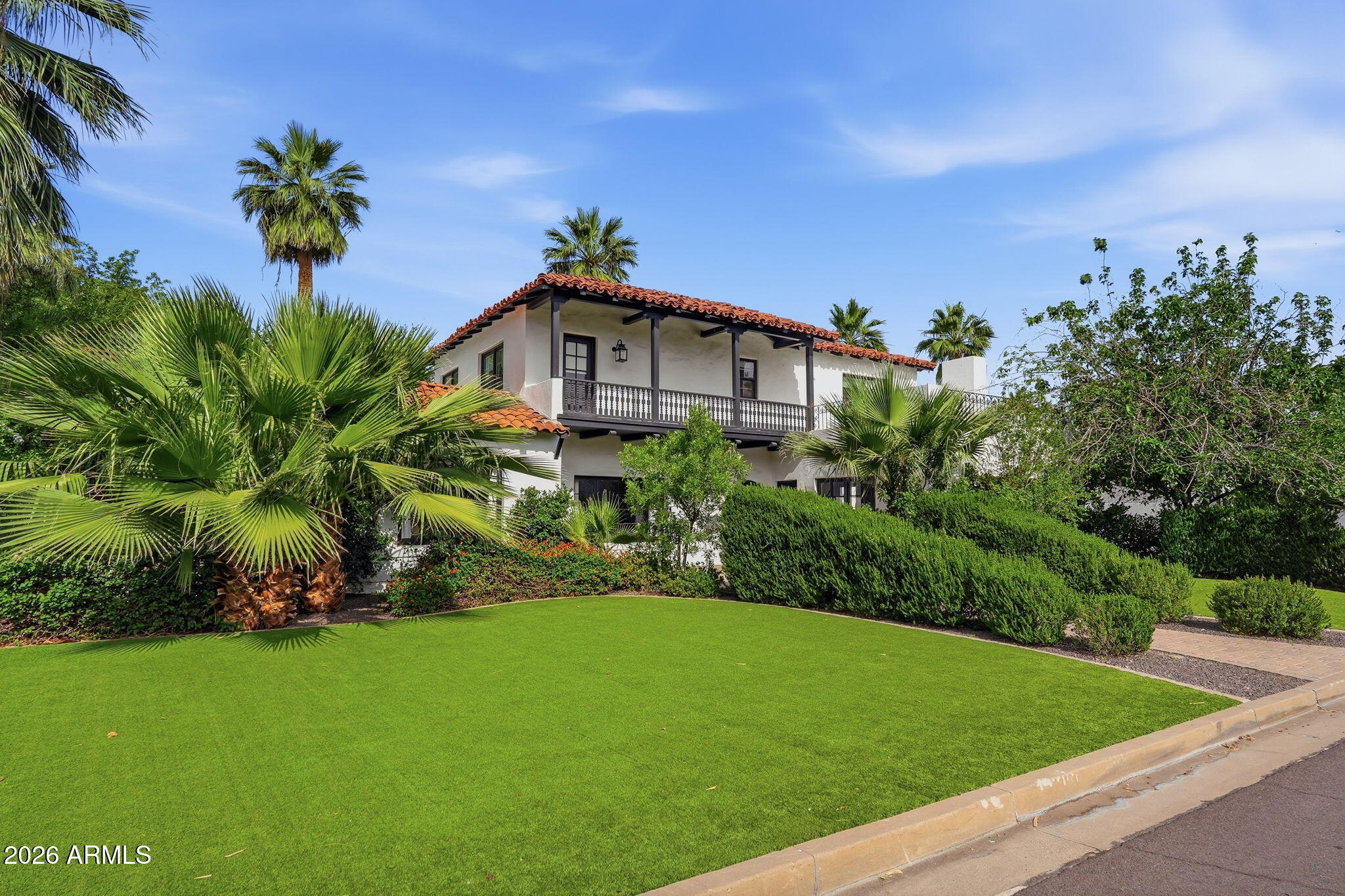 The Harry Tritle House is a beautifully restored 1928 Spanish Mission estate in the coveted Alvarado Historic District. Built for the son of territorial governor F.A. Tritle, this landmark blends rich Phoenix history with refined modern luxury. A recent renovation elevates the home with an open layout, exquisite finishes, and a chef's kitchen featuring Wolf/Sub-Zero appliances and a Miele coffee bar. Multiple folding glass walls create seamless indoor-outdoor living to the patio, pool, and spa. Original wood floors, vintage ironwork, and inlaid office flooring preserve its character, while four light-filled bedrooms each enjoy elegant baths. Upstairs, a gathering room complements three bedrooms; downstairs, a flex room opens to the pool. Re-landscaped grounds, mature trees, stone pavers, and the iconic river-rock fireplace complete this rare historic sanctuary near arts, sports, and city conveniences.