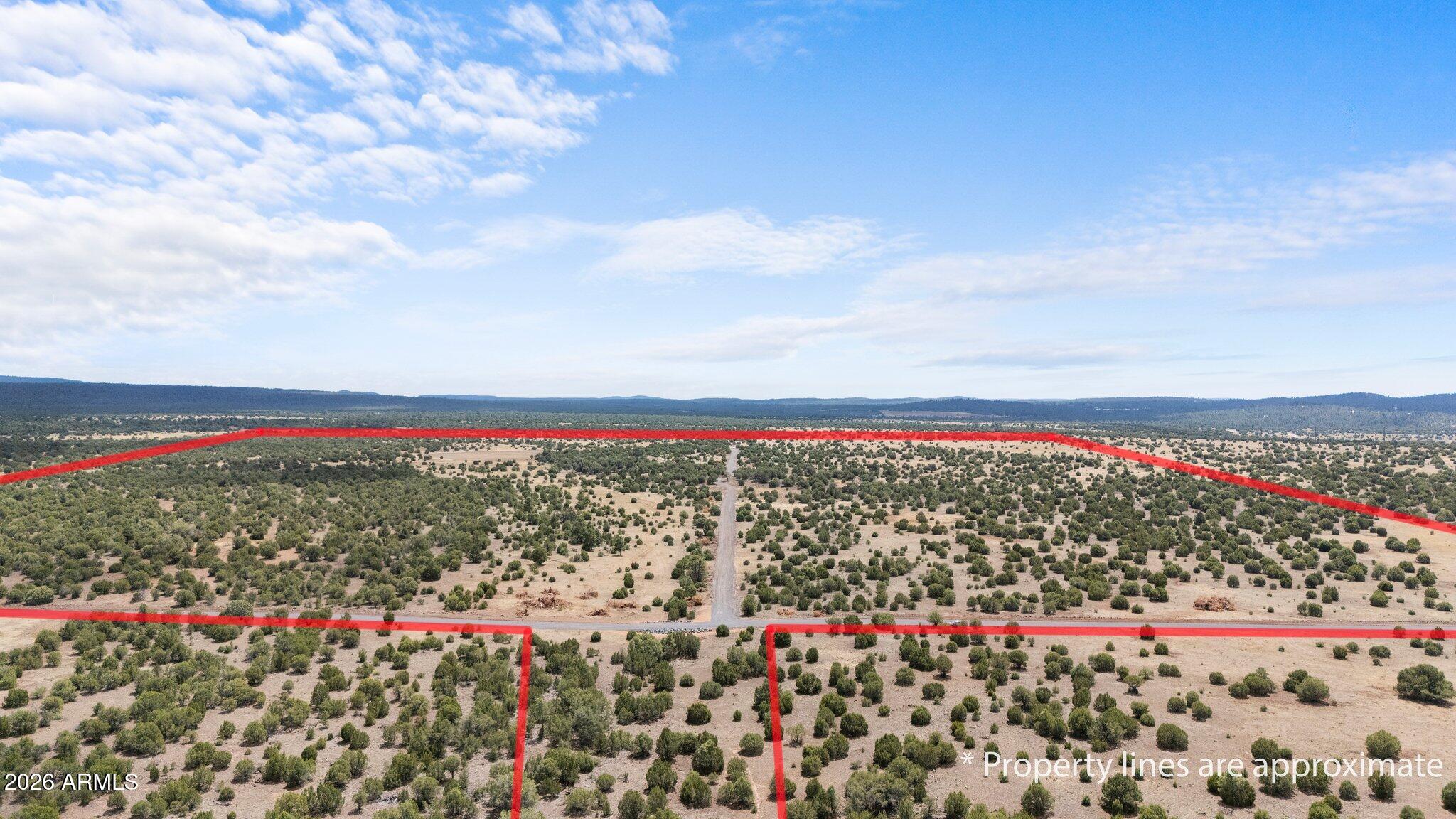 250± contiguous acres in the premier growth corridor of Show Low, directly across US-60 from the airport and adjacent to approved master-planned development. Rare large-scale Industrial zoning within city limits offers broad use rights and maximum flexibility, with easier potential rezoning to residential, commercial, or RV/resort. Dual access via 40th St & 50' easement to Cooley/Penrod. Road improvements complete; city water/sewer identified; power approx ¼ mile. 2021 appraisal $2,875,000. Seller financing available.