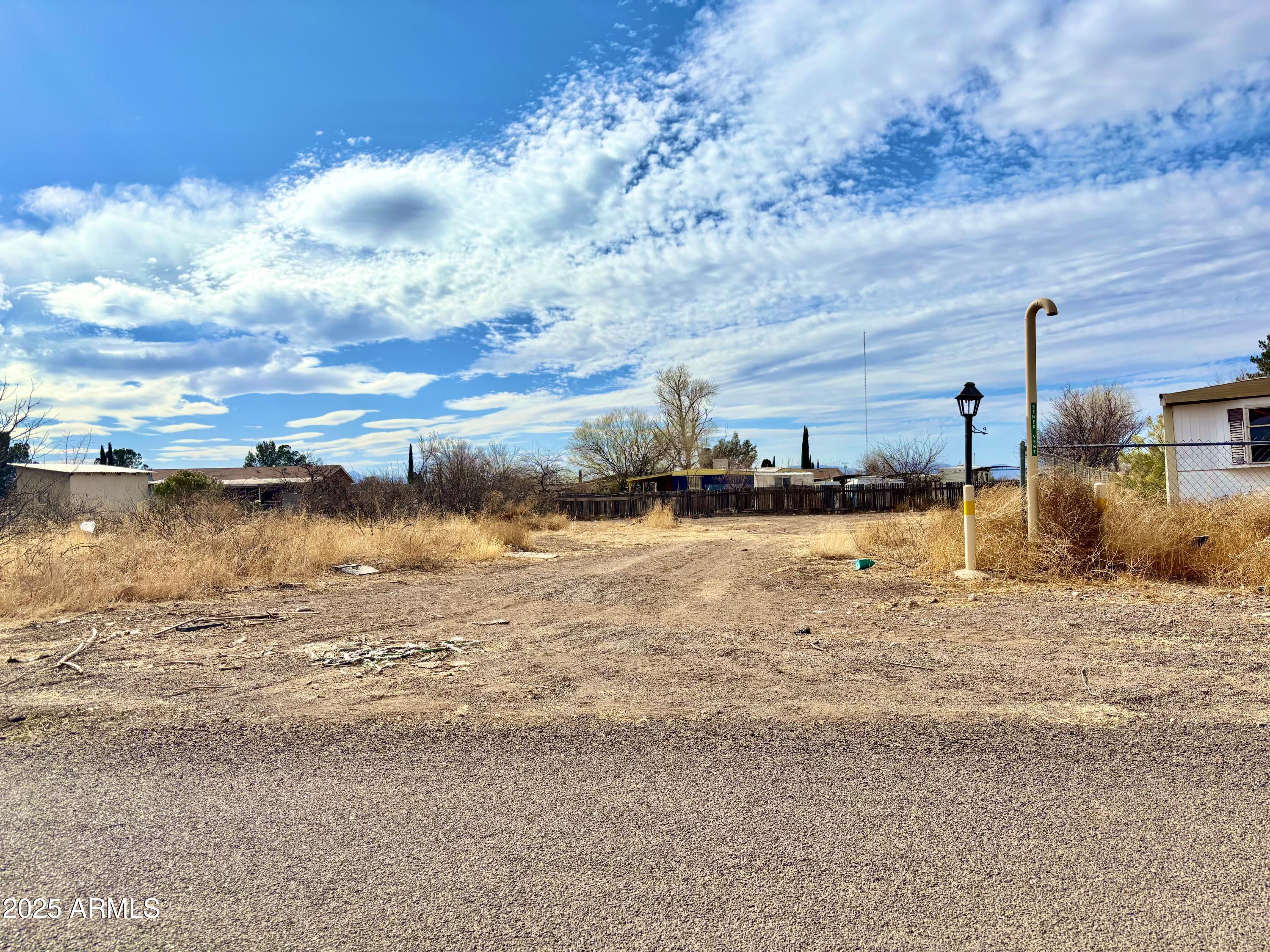 THE PRICE IS RIGHT!!!  Stop renting and take this opportunity of a clear vacant lot ready for you to build or bring in your mobile, manufactured home. The community has both types of homes. Along with a Convenient Store/Bar and Grill. Easy access from the Pan American Highway, close enough to town, yet not in the middle. 
         (BUYERS make your best OFFER)