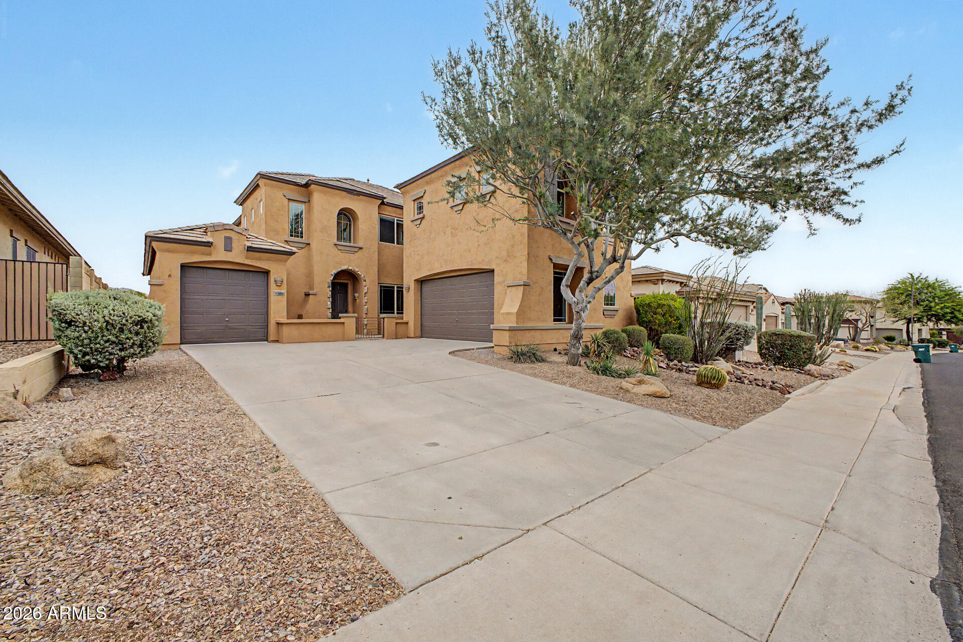 Experience elevated desert living  in this exceptional Anthem home, where truly breathtaking mountain views take center stage views so stunning they are rarely matched. This spacious 5-bedroom, 3-bathroom model offers a thoughtful layout, including a convenient downstairs bedroom ideal for guests or multigenerational living. Inside, you'll find elegant porcelain tile and luxury vinyl plank flooring that blend style with durability. The kitchen is beautifully appointed with granite countertops, perfect for both everyday living and entertaining. Upstairs, a versatile bonus room opens to a private deck, creating the ultimate space to relax and take in the panoramic scenery. Located in one of Anthem's most sought-after areas, residents enjoy access to outstanding community amenities including