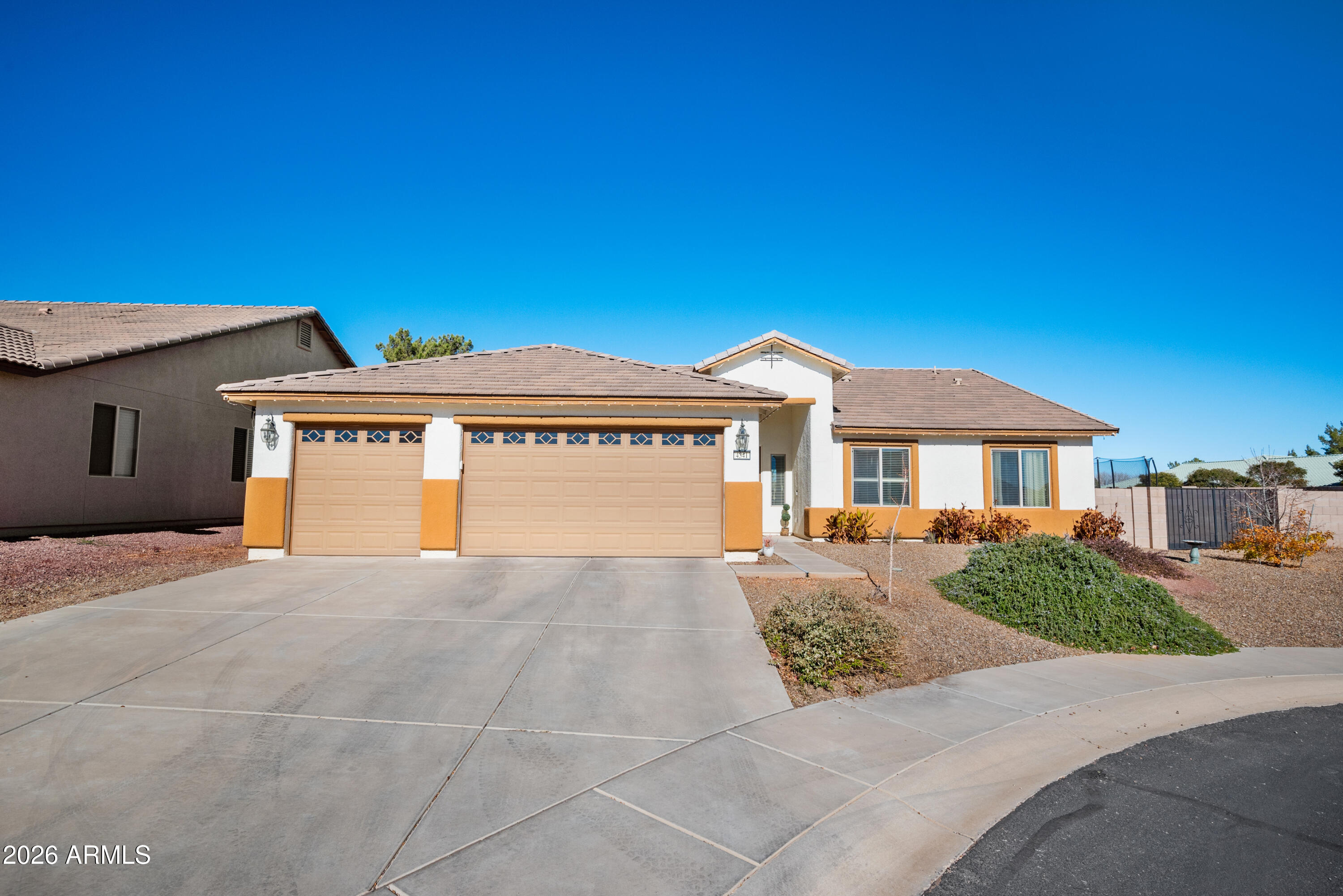 Beautiful 4 bedroom 2 bath home located in the highly desirable Holiday subdivision. This home features an open concept floor plan, offering both functionality and privacy.  the spacious primary suite includes a large bedroom and private en-suite bath. Enjoy Arizona living in the beautifully designed backyard, perfect for relaxing or entertaining year-round. Situated on a cul-de-sac lot for added privacy and a generous yard. Conveniently  located near the community clubhouse with pools, parks, fitness room, and more. A blend of comfort, location, and lifestyle.