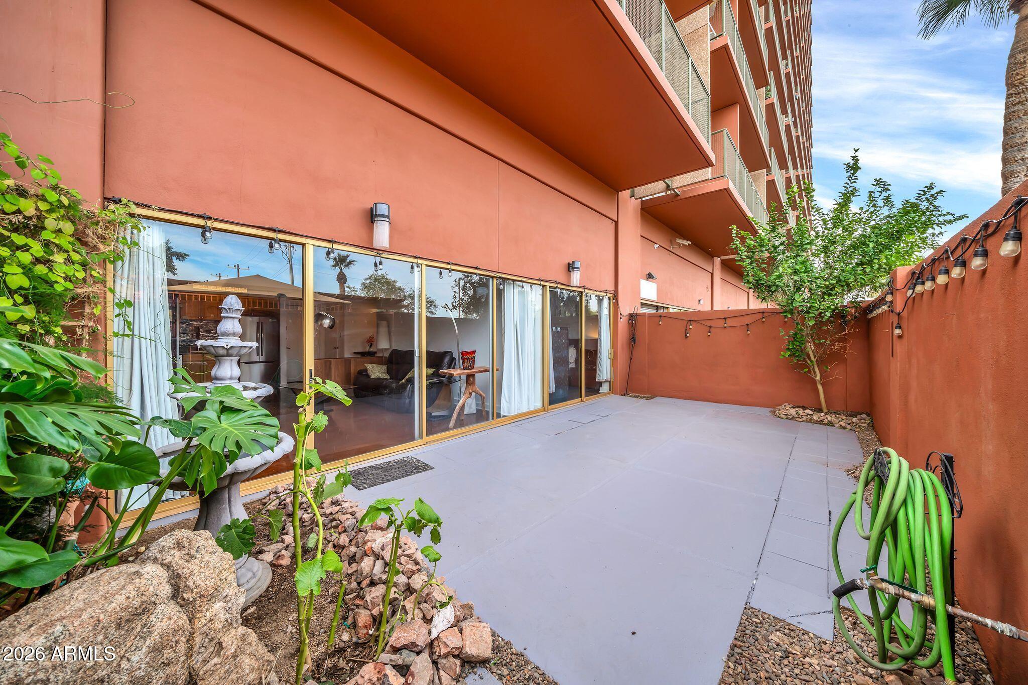 Easy breezy indoor-outdoor living located in the heart of Phoenix near upscale restaurants, shopping, great schools and airport. With a private back gate entry, this condo is a rare opportunity on the first floor of the historic Landmark, making the elevator optional. It has an incredible outdoor patio with mature tree and water feature. New neutral tone paint, polished concrete floors, stainless steel appliances included. Another rare find is laundry capabilities plumbed in closet. Covered parking spot, 24 hour security, heated outdoor pool, gym, rooftop patio with million dollar views, community gathering room and kitchen, dog run, billiard room, and cinema, air conditioning/heat, and water are included. Five year seller financing with balloon could be an option with credit approval.