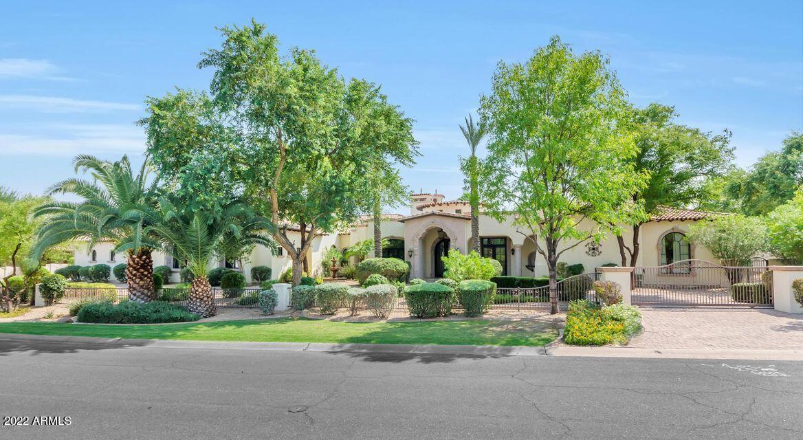 Privately gated estate with beautiful mountain views. This home was elegantly crafted by Tiamet & Jordan. The chef's kitchen has a massive island which is perfect for entertaining. Master features his/hers closets, his/hers water closets, washer/dryer & sitting room that can be a nursery, exercise room or another closet, 4 additional ensuite bedrooms, office w/ separate exit, climate controlled wine room, 2 powder rooms in the main house, full size theater room & Crestone smart home controls AV, lighting and security, climate controlled 4 car garage. Backyard oasis featuring a heated pool/spa w/ waterslide, grotto, lg grass area & side yard w/RV gate. Also features Casita with own garage.