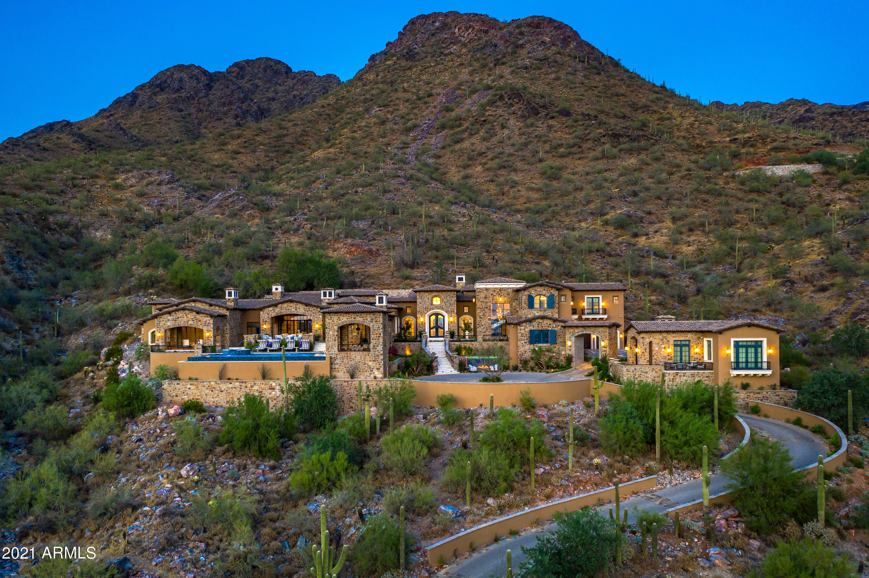 Introducing ''The Castle On The Hill'', a newly completed hillside masterpiece that is located in a private corner section of Upper Canyon Silverleaf.
