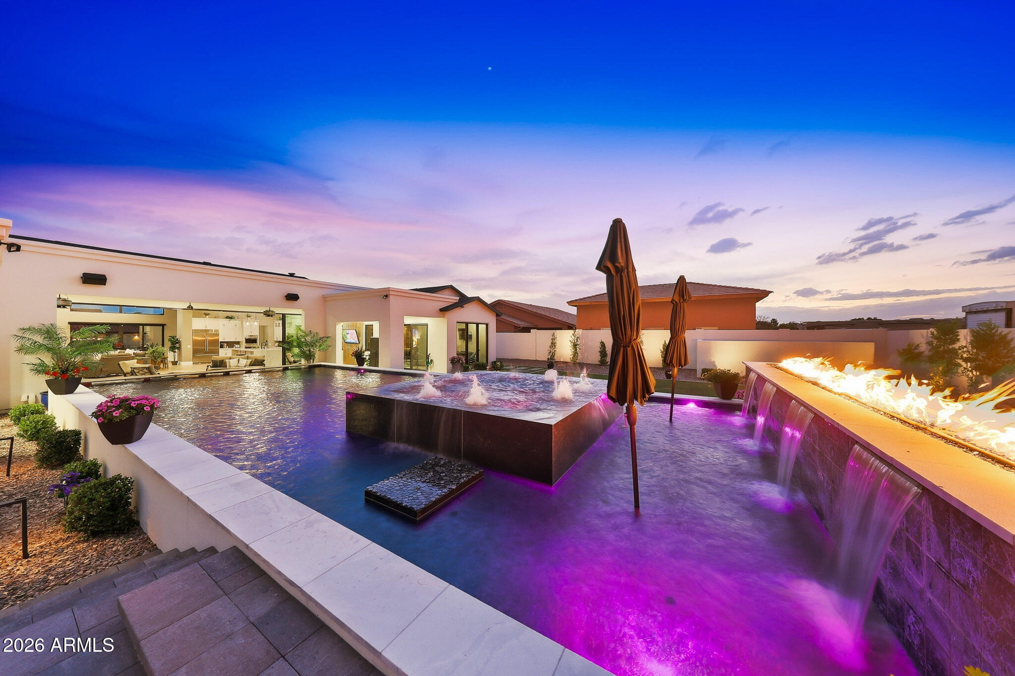 Luxury Desert Entertainer's Dream - No HOA! Designed for entertaining & indoor-outdoor living, this property features a 47' wall of sliding glass doors that open to breathtaking views of the resort-style backyard. Step outside to your private oasis with a sparkling pool, relaxing spa, and expansive patio space perfect for gatherings. Inside, the open-concept floor plan showcases spacious living areas, abundant natural light, and seamless flow between the kitchen, & great room. This home offers 4 bdrms, 3 baths, and 2 powder rooms, providing plenty of space for family and guests. The oversized 3 car garage and RV gate offer storage and flexibility for toys, & recreational gear. With no HOA, modern design & and high-end custom features, this one-of-a-kind property combines luxury & comfort! custom features throughout, this one-of-a-kind property combines luxury &  comfort!
Experience modern luxury living in this stunning custom home in Peoria!