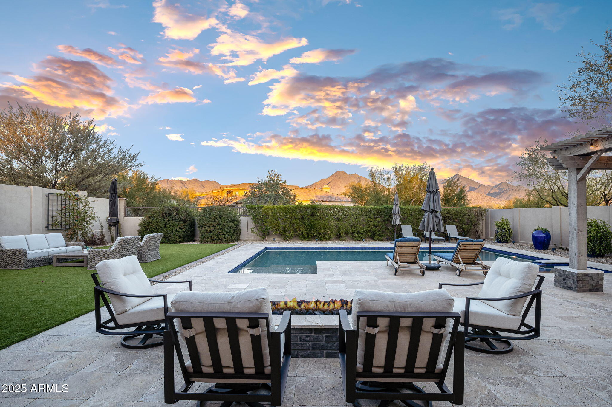 Luxurious Living in Windgate Ranch. Welcome to your dream home in the highly sought-after guard-gated community of Windgate Ranch! This stunning home is designed for ultimate comfort and luxury, offering exceptional blend of elegance and functionality. Situated on a premium lot with views of the majestic McDowell Mountains with an eastern exposure this home is truly a rare find. The interior features a thoughtfully designed open floor plan, perfect for modern living and entertaining. All on one level are the Primary bedroom, 3 bedrooms including a casita, on the 2nd level are the office with views and the 5th bedroom. The gourmet kitchen is a chef's delight, equipped with top-of-the-line Viking appliances, double islands, a walk-in pantry, two sinks, and two refrigerator drawers. An elegant wet bar equipped with an ice machine and a wine fridge, and the spacious primary suite, conveniently located on the main level, boasts two oversized walk-in closets with a stacked washer and dryer, split vanities, and a luxurious stand-alone bathtub. An attached casita, accessible via both private entrance and main house, provides flexible options for guests or multigenerational living. Upstairs, you'll find an additional bedroom, a full bath, a spacious game room/loft, and a balcony offering stunning view, making a total of 5 bedrooms and 4 1/2 bathrooms.

The backyard is a true outdoor oasis, featuring a self-cleaning, salt-water and heated pool and spa, a built-in grill with dining bar, cozy fire pit, and an expansive artificial turf area.

Nestled within the Sonoran Desert in North Scottsdale Windgate Ranch offers an unparalleled lifestyle with 24/7 guard-gated security and an array of amenities, including a clubhouse, multiple heated pools, tennis and pickleball courts, basketball and volleyball courts, children's play areas, and abundant open green spaces. Prime location close to Scottsdale's best golf courses, shopping, dining, and provides easy access to both Scottsdale and Sky Harbor airports. Don't miss this opportunity, make this exceptional property your NEW home!