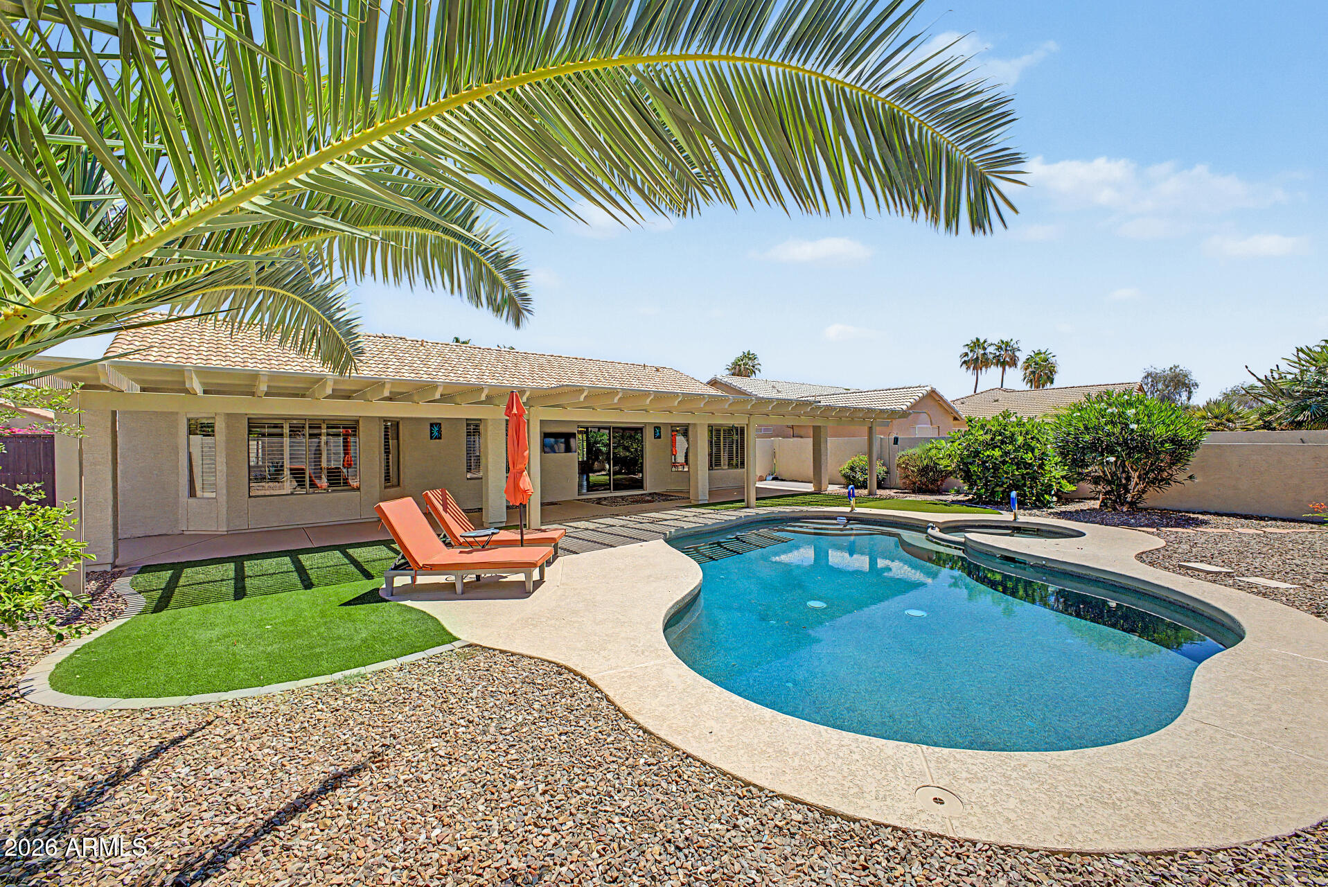 Spacious Extended Palmera model offering 2 bedrooms, 2 baths, and a versatile flex room that can serve as a den or 3rd bedroom. Both bedrooms feature bay windows for added space and natural light. Enjoy easy maintenance LVP flooring throughout, a large laundry room, newer appliances, a generous primary closet, and a newer A/C system. Step outside to your private backyard oasis with a beautiful pool, fresh cool decking, artificial turf, paver accents, a full length covered patio with attached large pergola, perfect for relaxing or entertaining. This home combines comfort, functionality, and exceptional outdoor living.