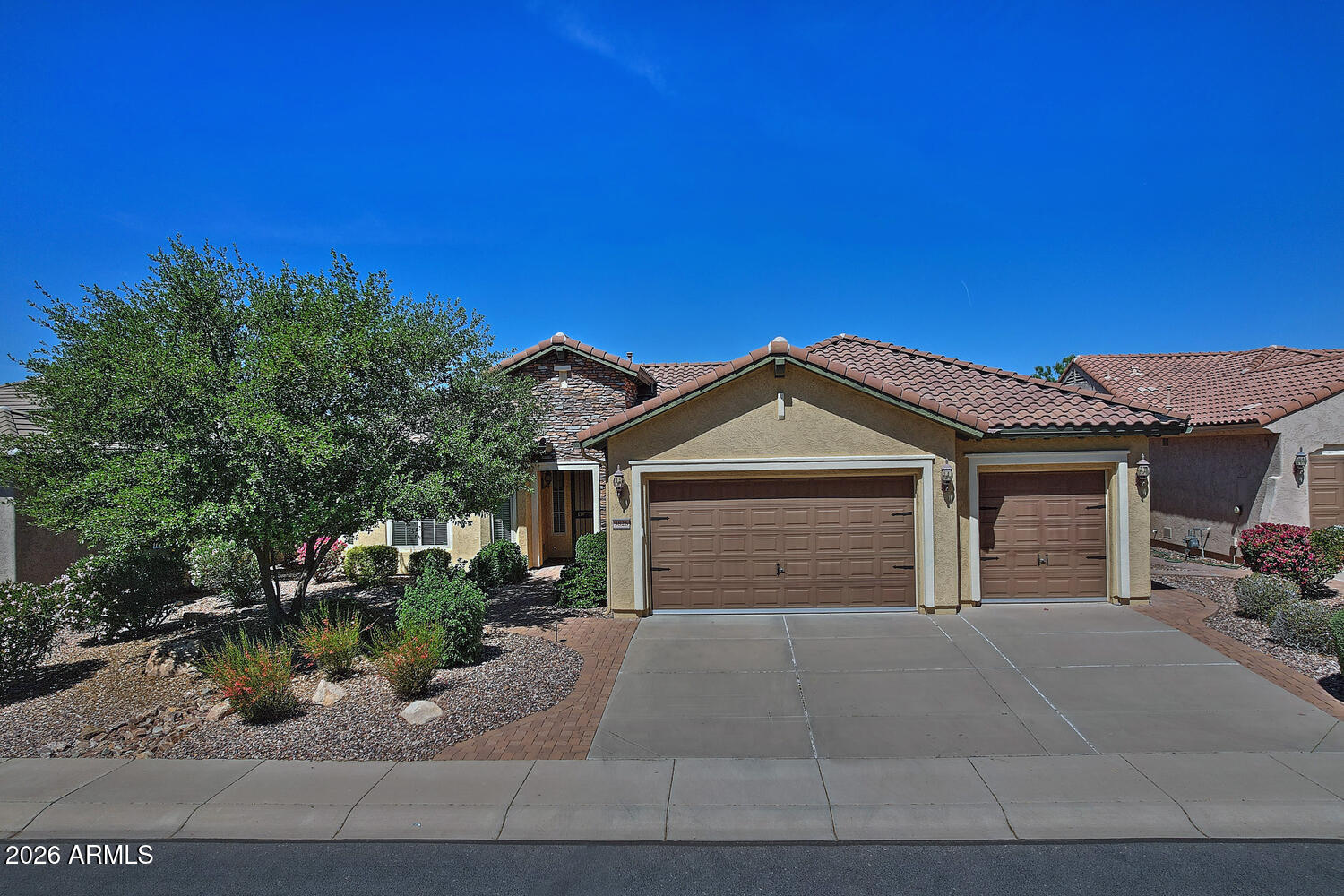 Welcome to this beautifully designed ''FURNISHED'' Concord floorplan ideally situated on the 13th fairway of the Poston Butte Golf Course, offering stunning golf course views and a peaceful setting. This 2-bed, 2-bath home features comfortable living spaces and quality upgrades throughout. The kitchen is equipped with stainless steel appliances, double ovens, and ample cabinetry, making it perfect for both everyday living and entertaining. The living room features a cozy fireplace, creating a warm and welcoming atmosphere. The spacious primary suite boasts a sliding door to the patio, dual sinks and separate tub/shower. Another standout feature of this home is the 3-car garage, including a heated and cooled workshop bay--ideal for hobbies, projects, or additional workspace. A MUST SEE HOME