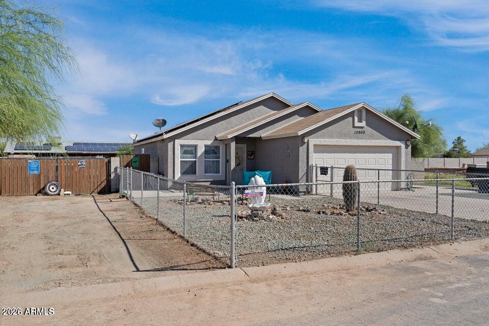 MOTIVATED SELLERS;This charming home is ready for you! It features a cozy kitchen adorned with granite countertops, white cabinets.  You'll find ample storage throughout the house. The spacious backyard offers plenty of room, complete with RV parking, RV gate, plus 2 walk through gates, & a dog run. A clean slate for your landscaping ideas, and NO HOA fees.
This home has solar panels to help control the utilties in the Az summer months. APS  Electric bill from May 2025- April 2026

May 2025  -$208.88
June 2025  -$170.29
July 2025  -$138.41
August 2025 -$108.11
September 2025  -$69.52
October 20.25  -$30.14
November 2025  $8.45
December 2025  -$192.11
January 2026  -$58.70
February 2026  $30.38
March 2026  $94.85
April 2026  $38.99