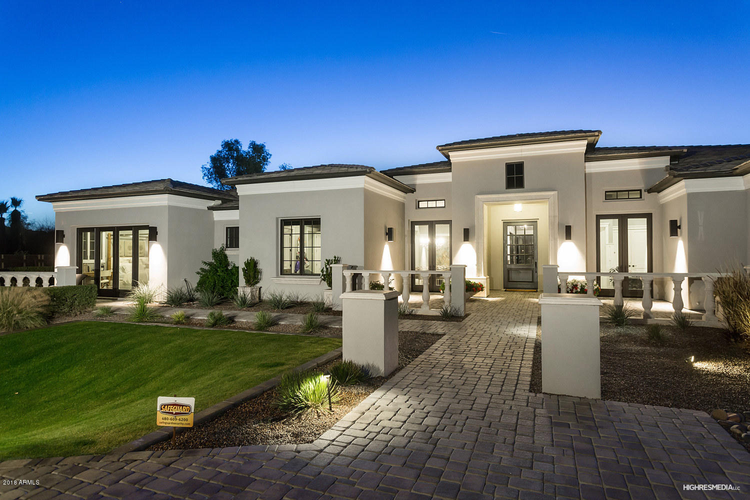 Welcome to your beautiful 2 year old, custom home in Paradise Valley.  This well designed, entertainer's dream home features a split floor plan with 6 bedrooms, 5 1/2 baths, and a 4 car garage. This home also includes a gorgeous chef-inspired gourmet kitchen complete with sub-zero and a Wolf appliance package. Enjoy entertaining? Your new home includes a large media/game room, a full bar, custom wine cellar, fireplace, intricately detailed 14' coffered ceilings and breathtaking, wall to wall views of Camelback mountain. Your private master retreat is complete with a wet bar, fireplace, and sitting area - as well as a luxurious oversized master bath with his/her closets, and vanities, soaking tub and large walk-in shower. This home has a beautifully landscaped large backyard complete with a heated pool, spa and plenty of room.  No detail has been overlooked and it is an opportunity not to be missed.