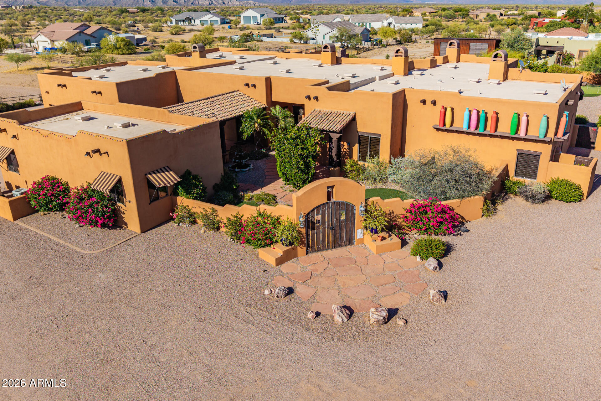 Beautiful custom-designed luxury home featured near the Granite Mountain trailhead in north Scottsdale, AZ. Laid out in plush desert foliage with beautiful views of the mountains. This estate incorporates a subtle balance of contemporary finishes with a modern southwestern design. The home offers 6 bedrooms, 6 full baths, an open concept 6,695 sq ft] floor plan, upgraded kitchen w/ raised panel cabinetry, granite counter tops, SS appliances, a center (eat-in) island, and pantry. Additional home details will also include high ceilings, a dedicated dining space, formal & informal living space(s), multiple fireplaces, wood flooring, modern plumbing/lighting fixtures, plantation shutters, and lots of windows offering great natural light throughout the living spaces. The master retreat boasts a spacious sleeping quarters, an en suite w/ dual vanities, separate soaking soaking tub & shower, and large walk-in closet. Lastly, the home features a tranquil front courtyard w/ water fountain, whole house vacuum system, a separate 1/1 guest casita, a 4-car garage, large/private back yard w/ low maintenance plush landscaping, extended covered patio space, artificial turn  w/ putting green, and outdoor [lap] swimming pool--perfect for entertaining family and friends.