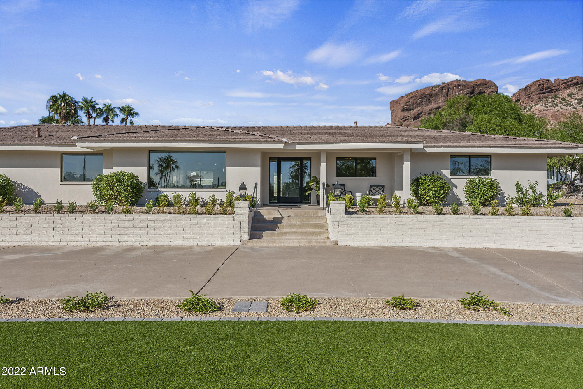 Exceptional transformation at the head of the Iconic Camelback Mountain! Luxurious & Lavish in TOP Location! This gorgeous home has been taken down to the studs! Top quality craftsmanship went into this recreation to capture the BEST 3,477 square feet of LIVING possible! Featuring open bright floor plan, exquisite chefs' kitchen, four bedrooms, three bathrooms, with designer touches throughout every square inch! Spectacular entertainers' outdoor paradise captivating views to immerse in the beauty of Arizona Living!