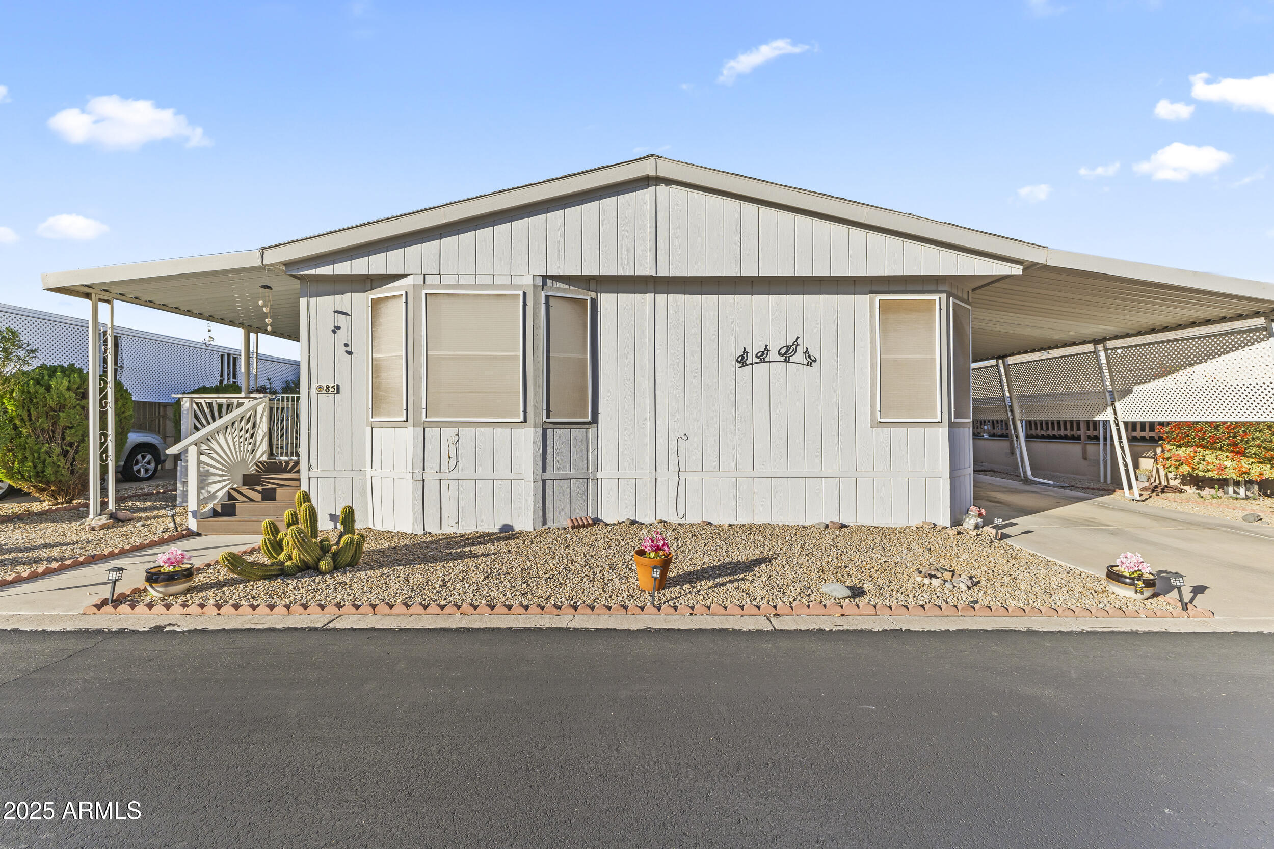 Discover comfort, convenience, and an exceptional lifestyle in this beautifully maintained 2-bedroom, 2-bath manufactured home located in the highly desirable Rose Gardens 55+ Community! This amazing 1,447 sq comes with a beautiful updated kitchen and even comes with a private patio to enjoy those beautiful Arizona mornings! Don't miss out! Community amenities: pool, heated spa, pickleball, shuffleboard, horseshoes, fitness room, dog park, and community room.