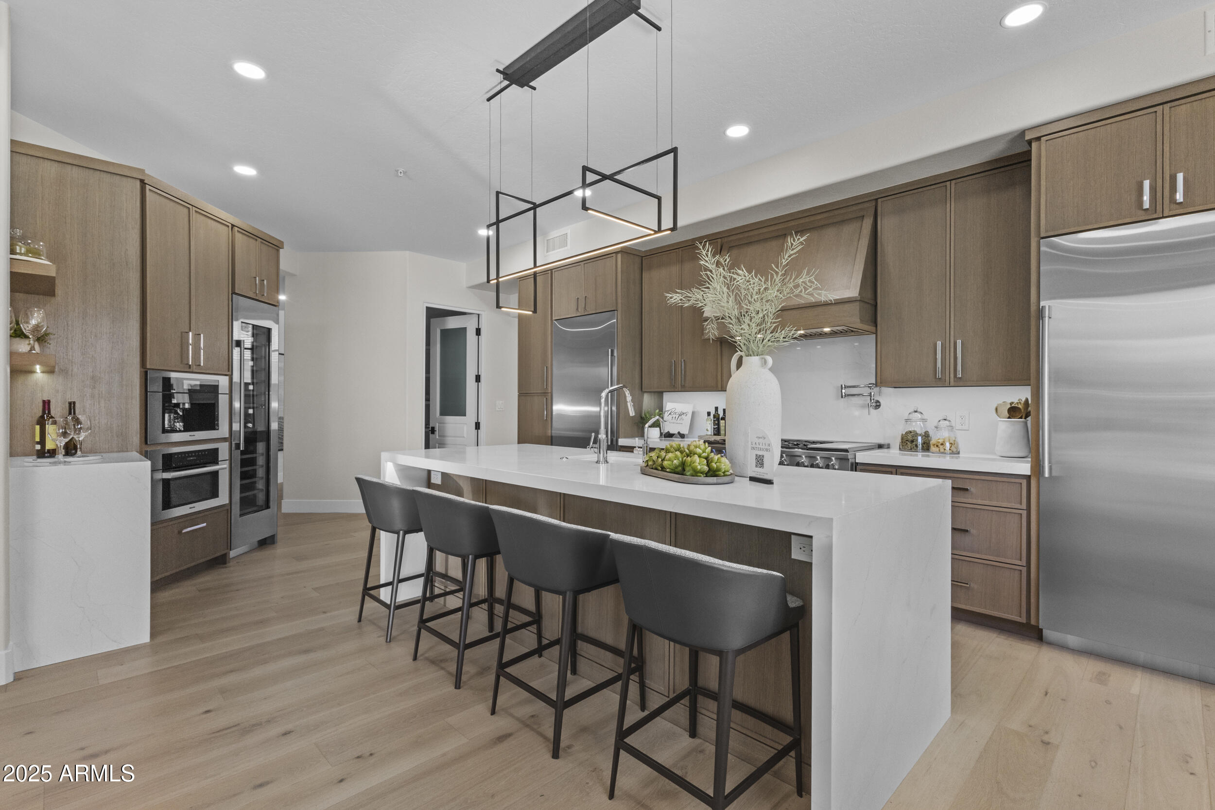 VOTED BEST HOME ON SCOTTSDALE TOUR! THE ONLY COMPLETE REMODEL AVAILABLE IN GAINEY RANCH AT THIS PRICE! Gated all Custom home community of North Meadow II. Exquisite finishes throughout this 4550SF 3 bed Plus Office and bonus room, 3.5 bath stunner with a 3 car garage. True Chef's Kitchen opens to large family room and flows to covered patio with misters and electric shades for indoor/outdoor living. Primary Suite masterpiece has sitting area and access to backyard. Primary bath features floating under-lighted vanities and massive walk-in closet with island. Low maintenance Lock&Leave lifestyle. PRELISTING INSPECTION AVAILABLE AND SUPER CLEAN! HOA includes access to The Estate club Pool, fitness center, Pickleball and Tennis plus Clubhouse and Bar.